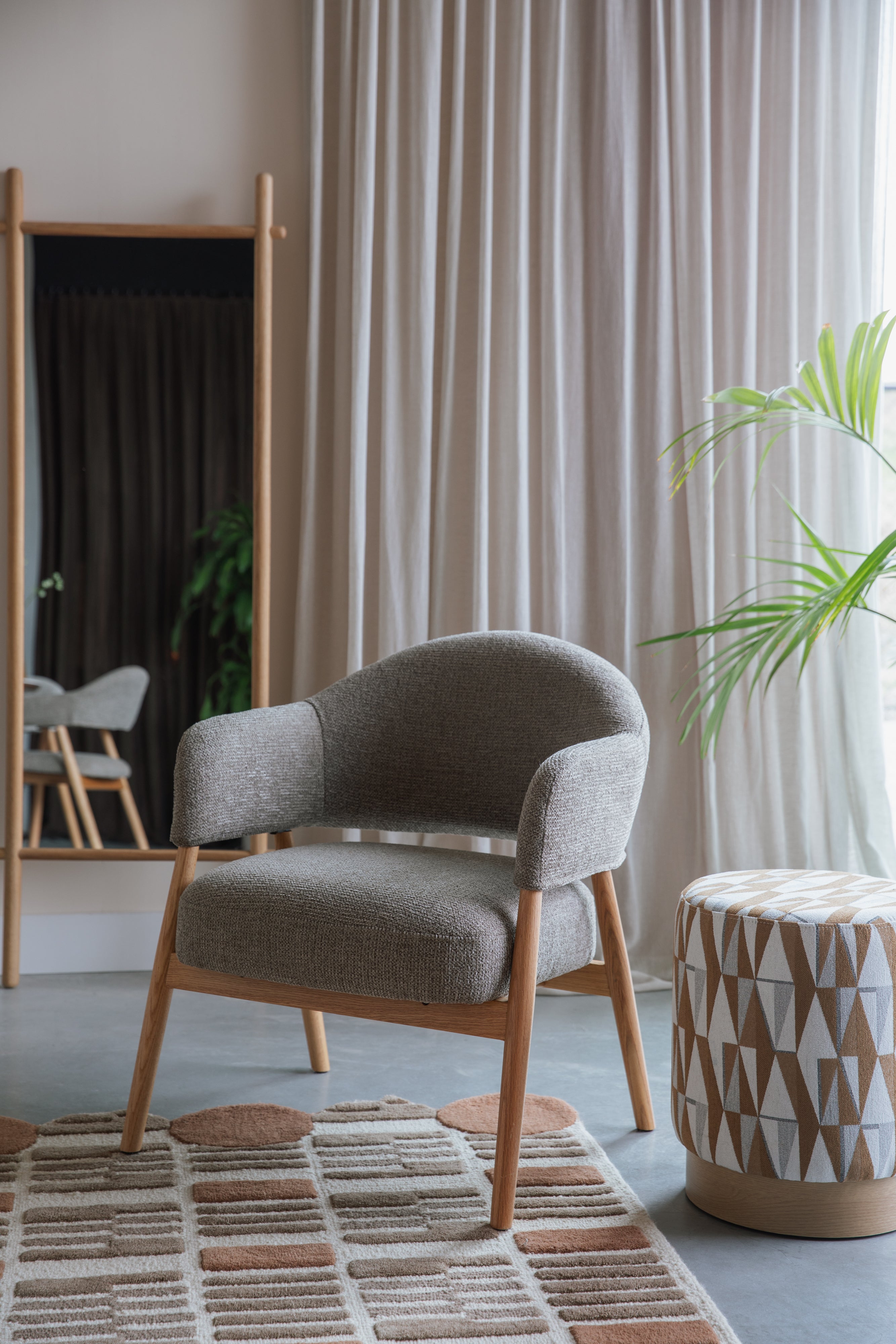 INDY brown armchair with wooden base