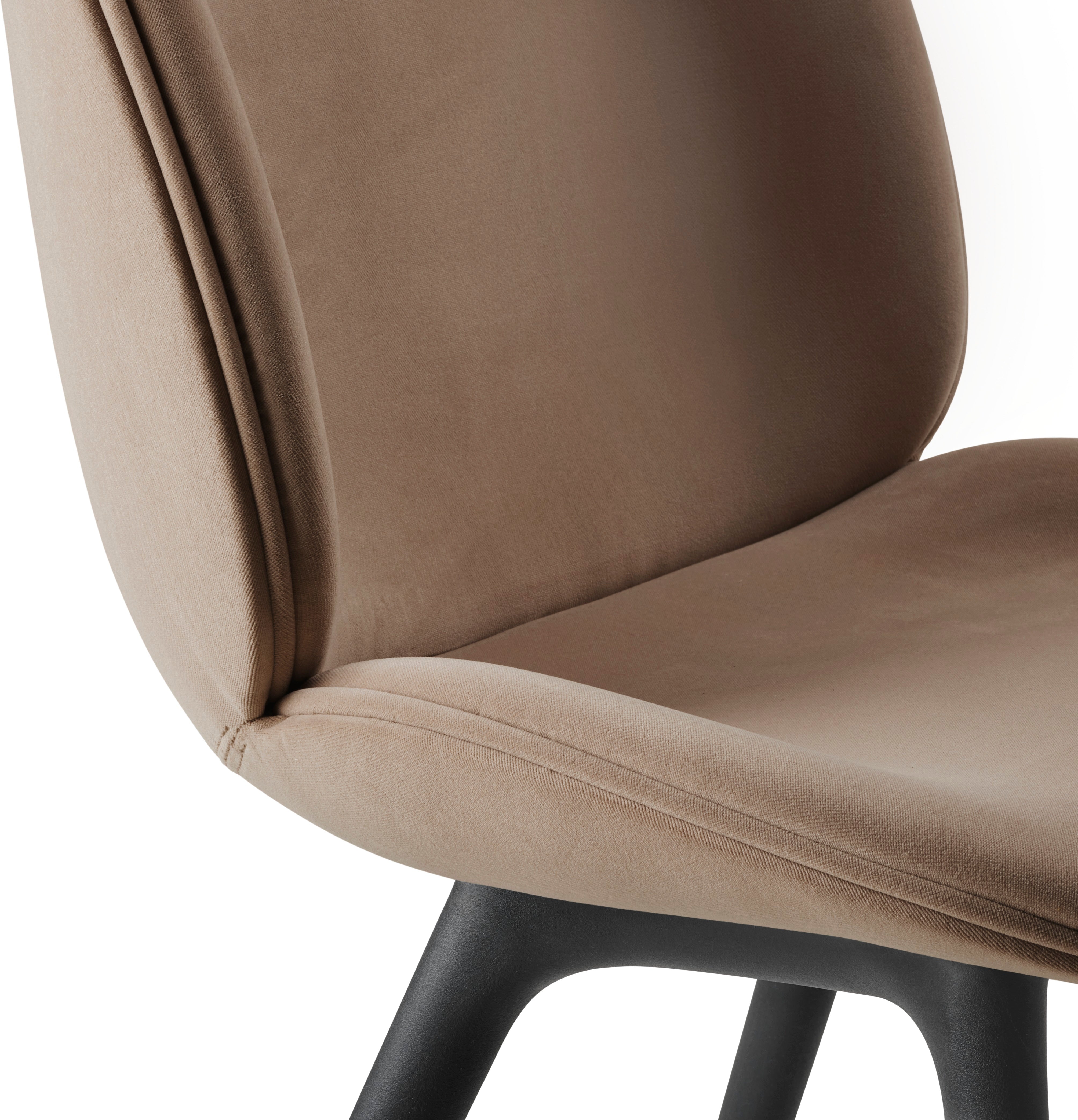 BEETLE upholstered chair with a black base