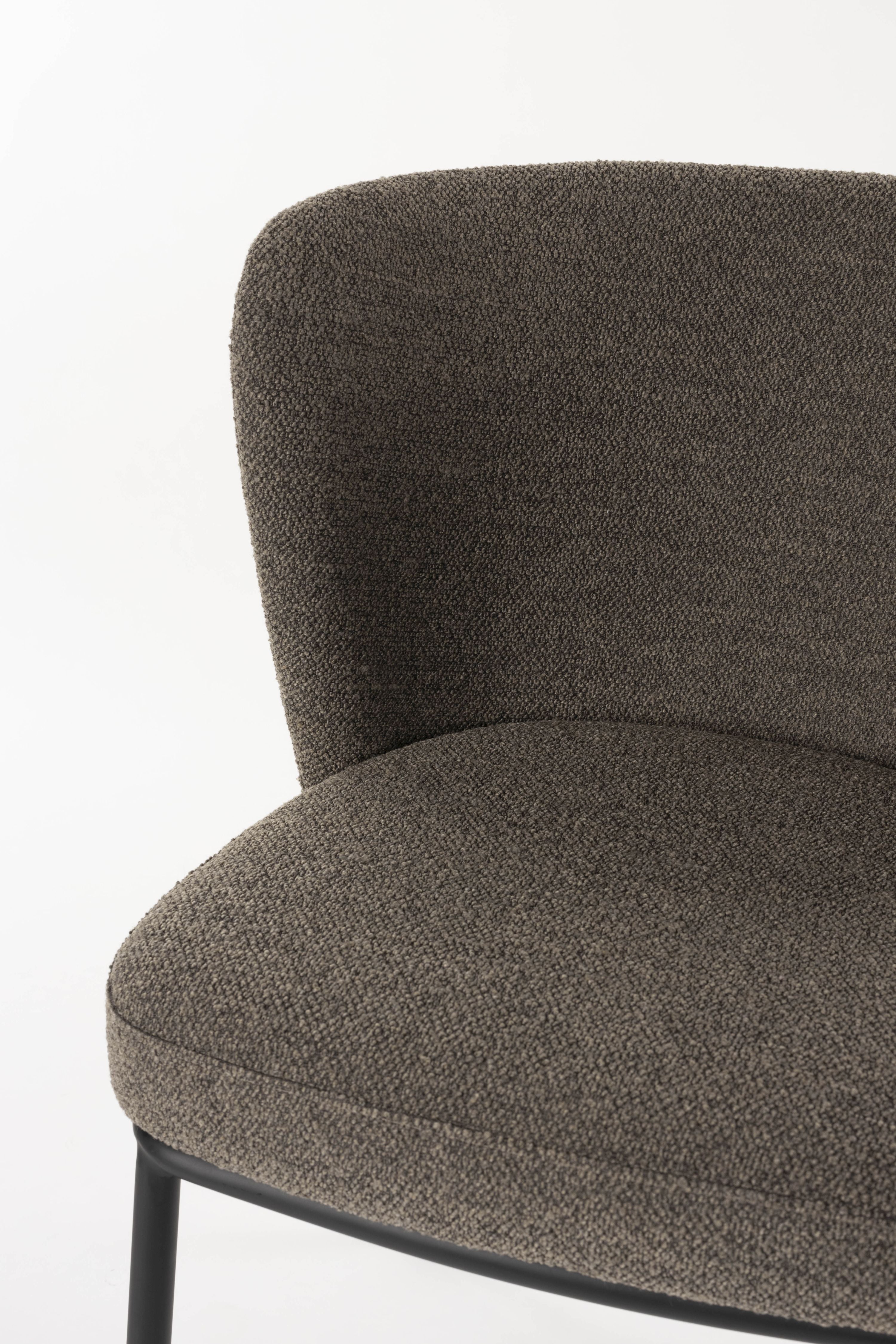 Brown guus chair with a black base