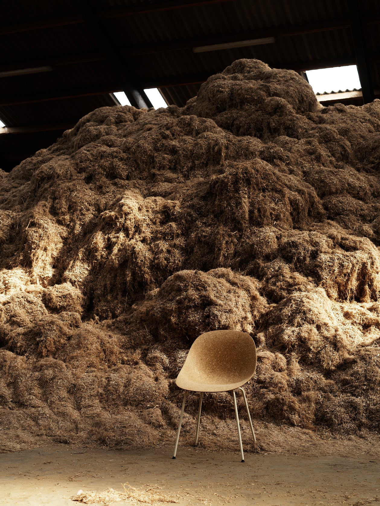 A beige mat chair with a black base