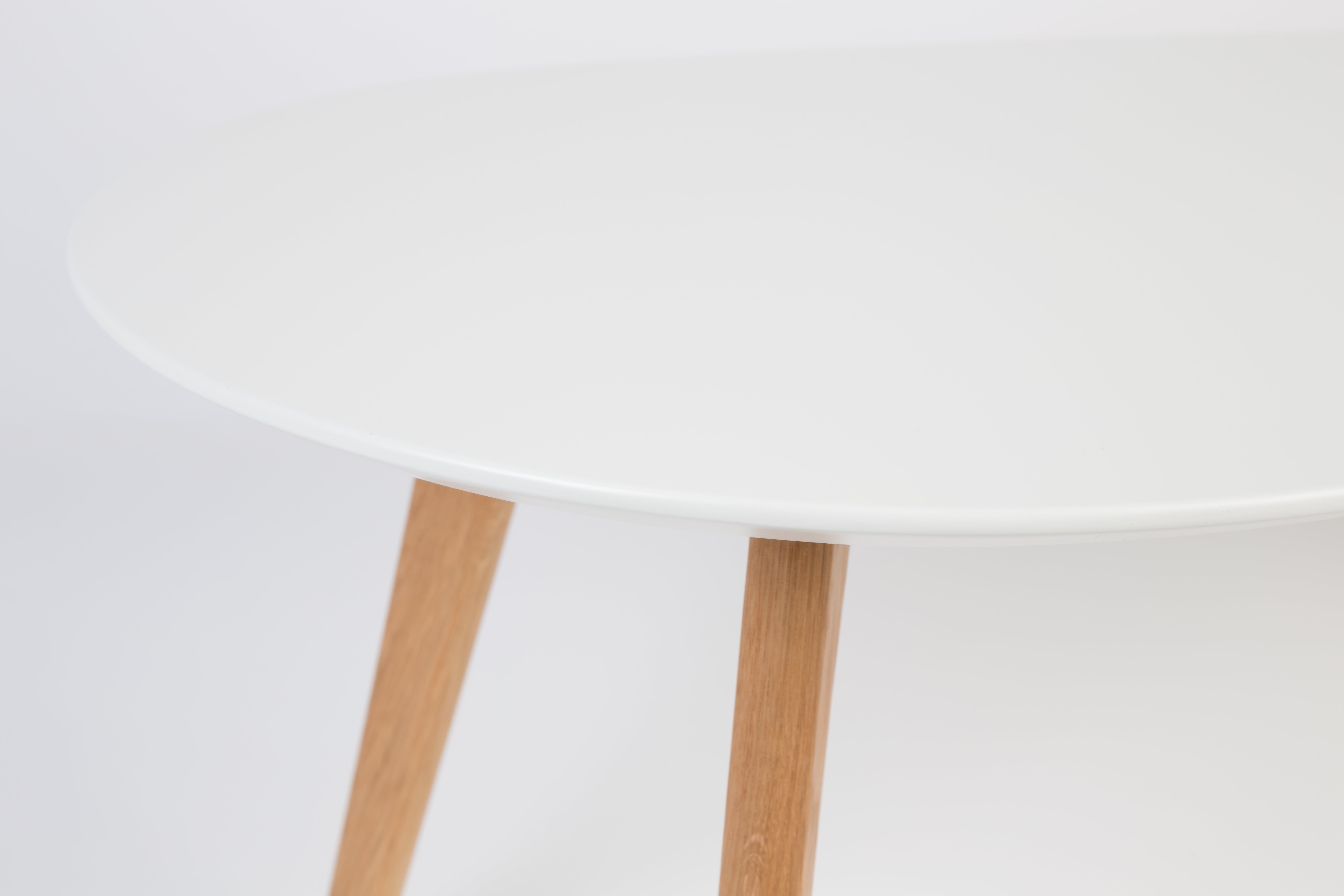 A set of white drop tables with a wooden base