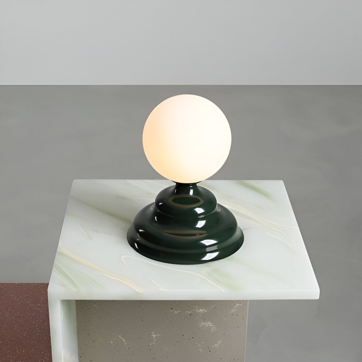 Table lamp with a glass lampshade green wave