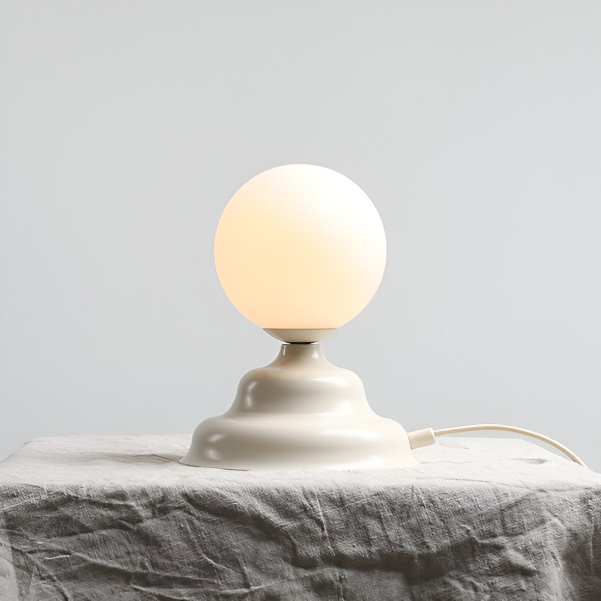 Table lamp with a glass lampshade cream wave