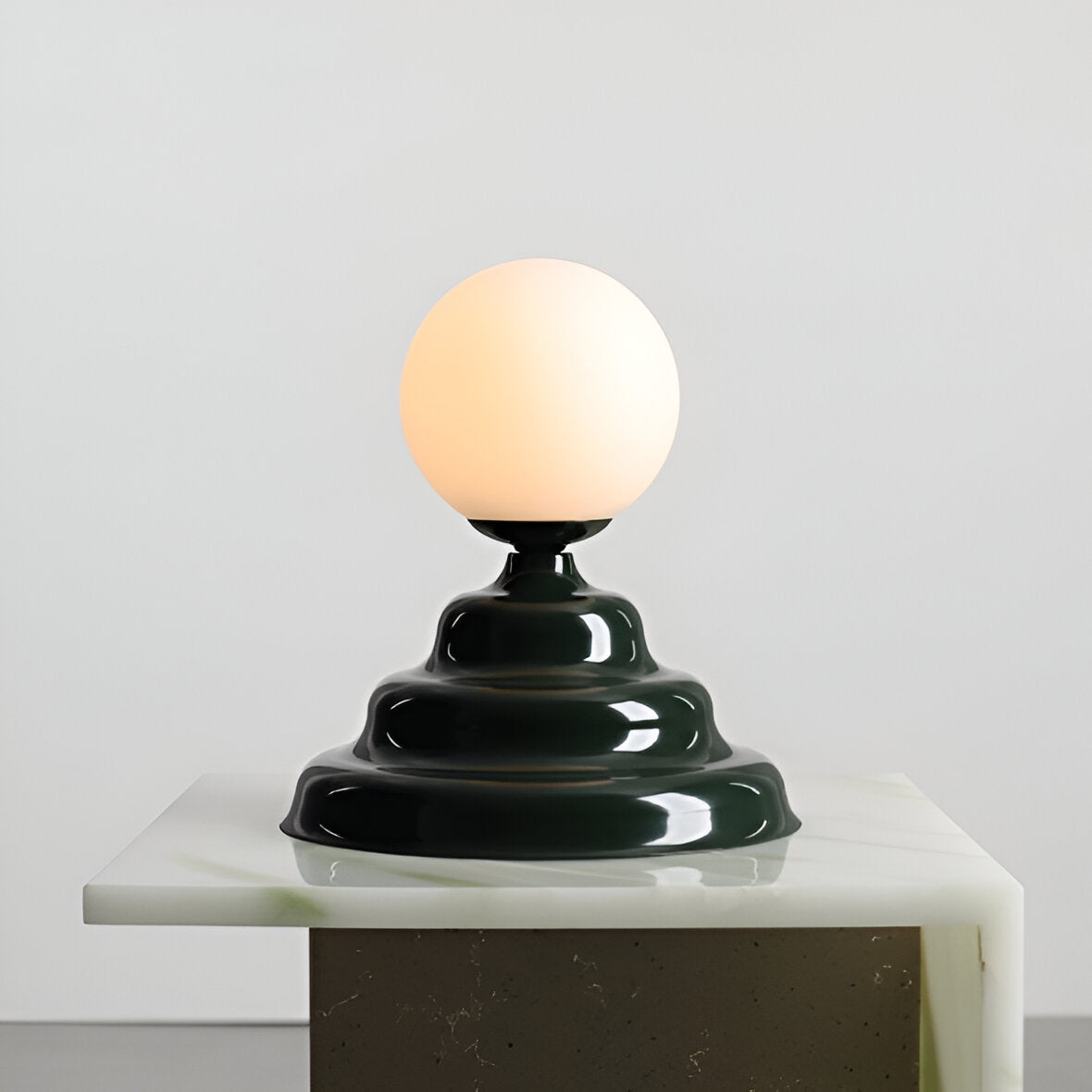 Table lamp with a glass lampshade green wave