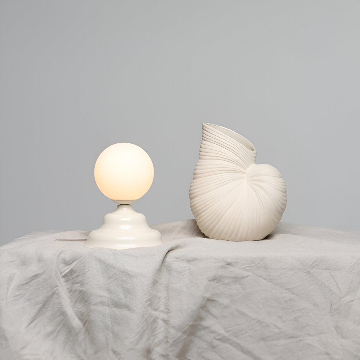 Table lamp with a glass lampshade cream wave