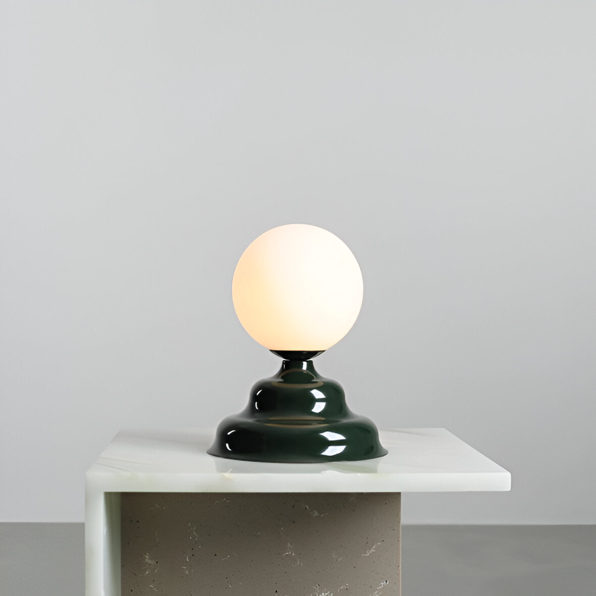 Table lamp with a glass lampshade green wave