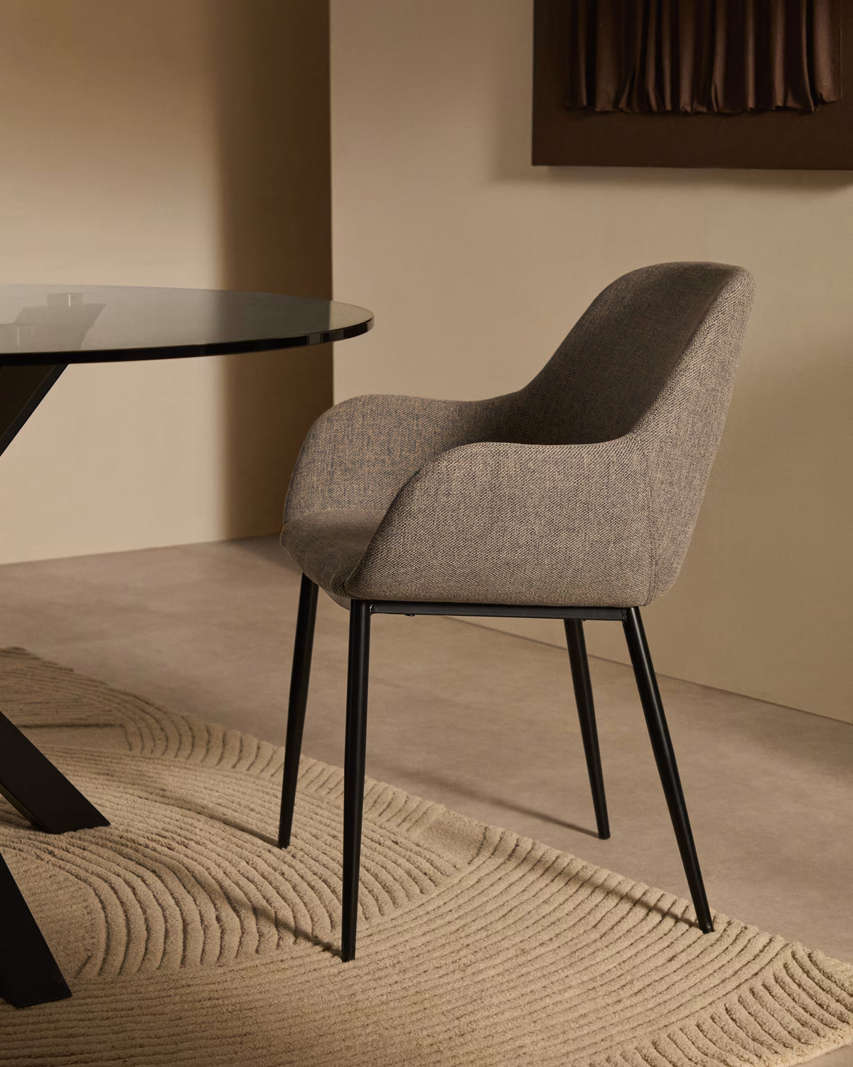 A chair in the bright -gray horse fabric with a black base