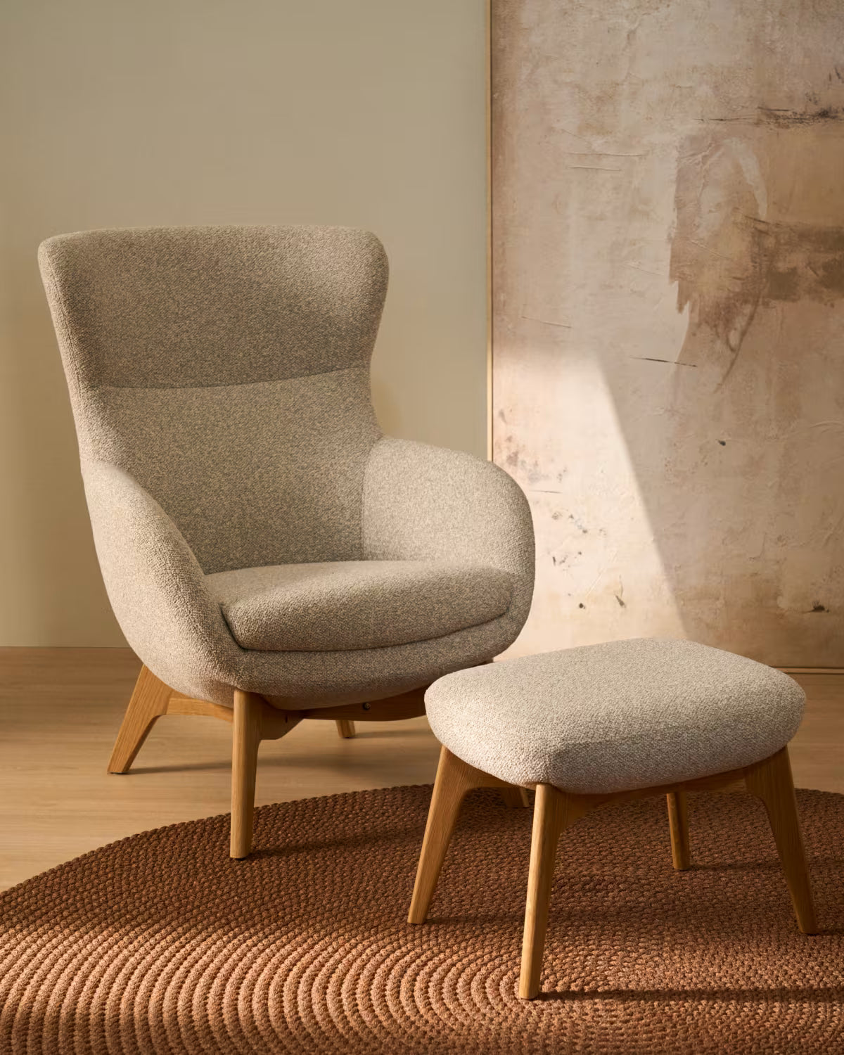 ADIRAN armchair in light beige chenille with a dark oak base.