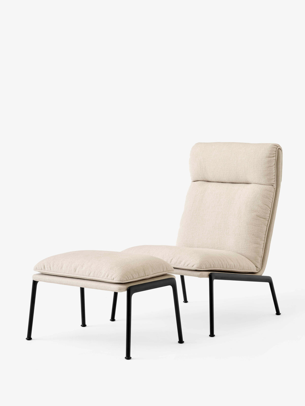 Upholstered MUNO LN20 footstool with a dark aluminum base