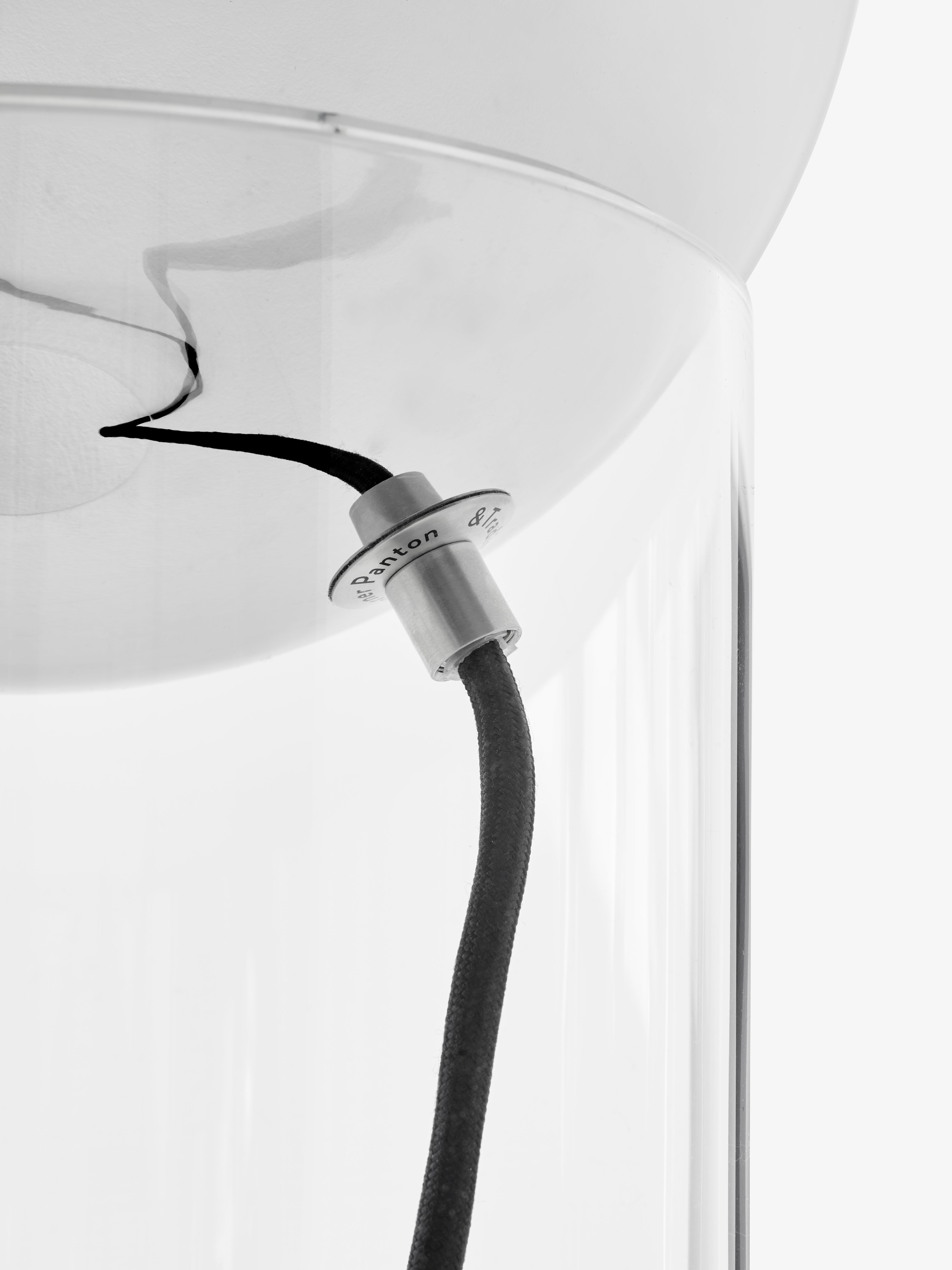 TOPAN VP13 table lamp with a chrome shade and transparent base.