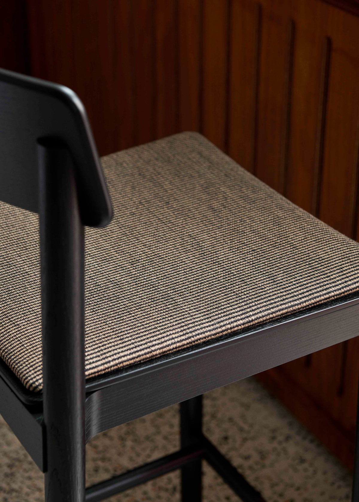 BETTY stool in black lacquered ash with an upholstered seat