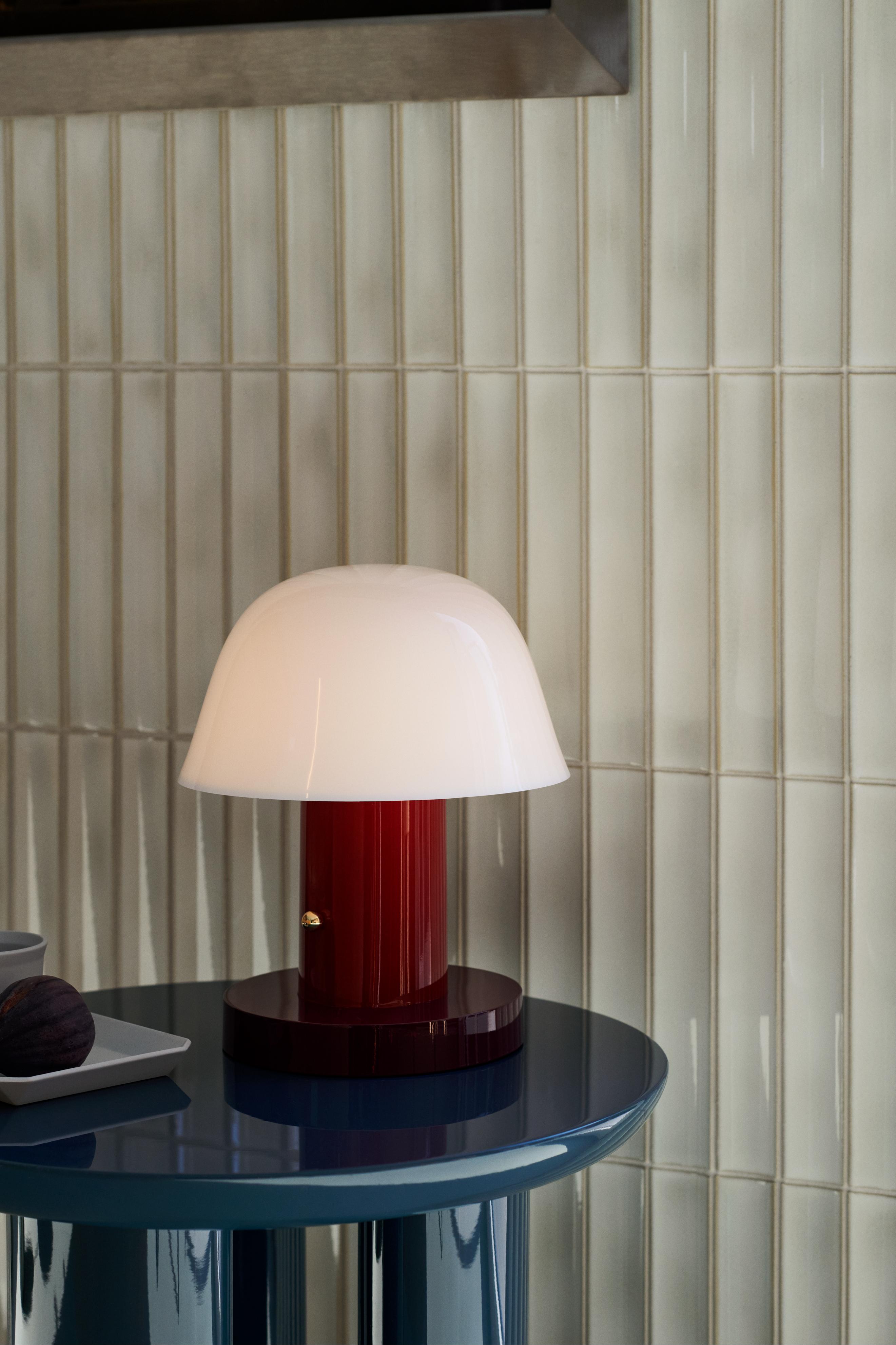 Portable lamp SETAGO JH27 with a cream shade and dark red base.