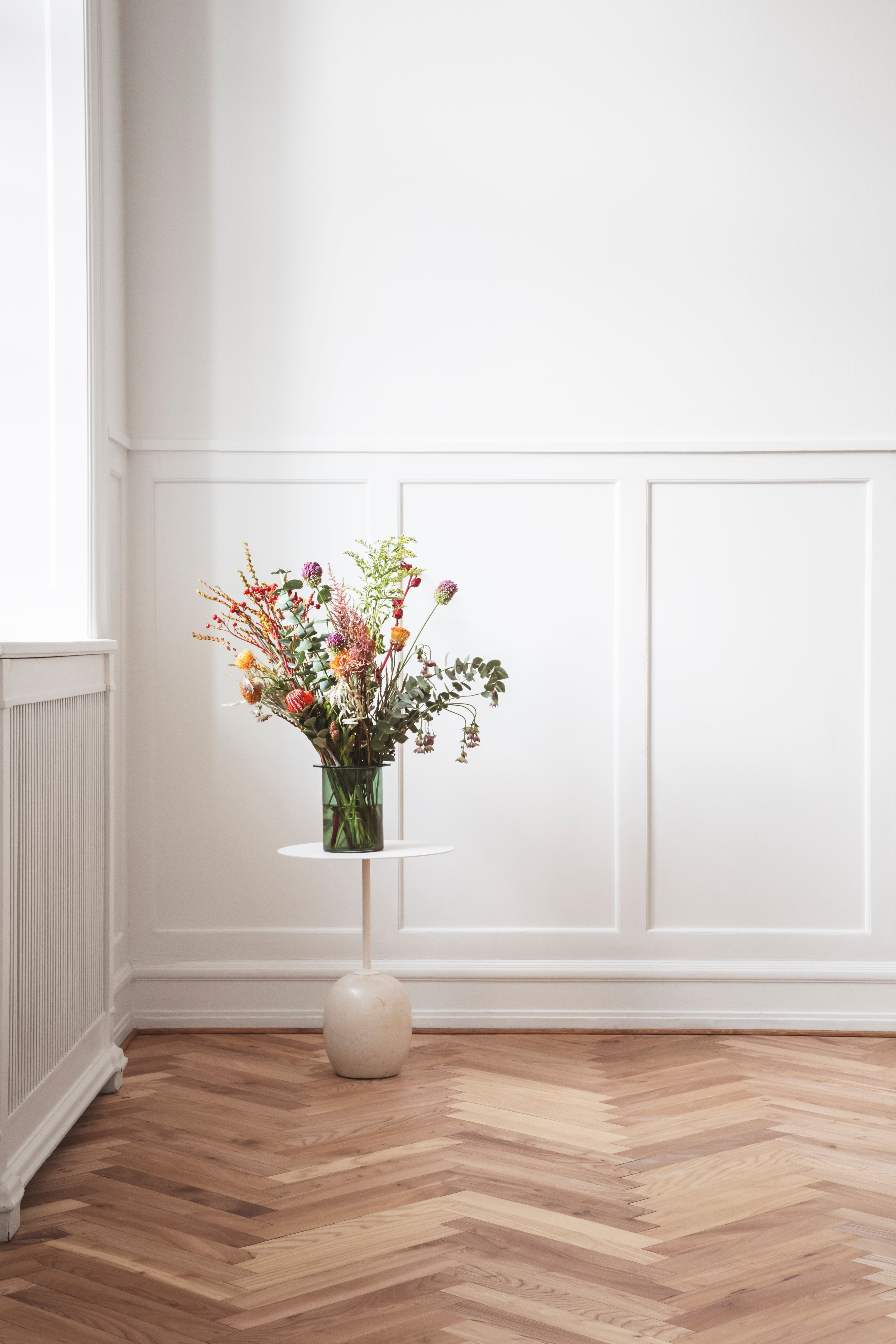 LATO side table with a cream top and beige marble base