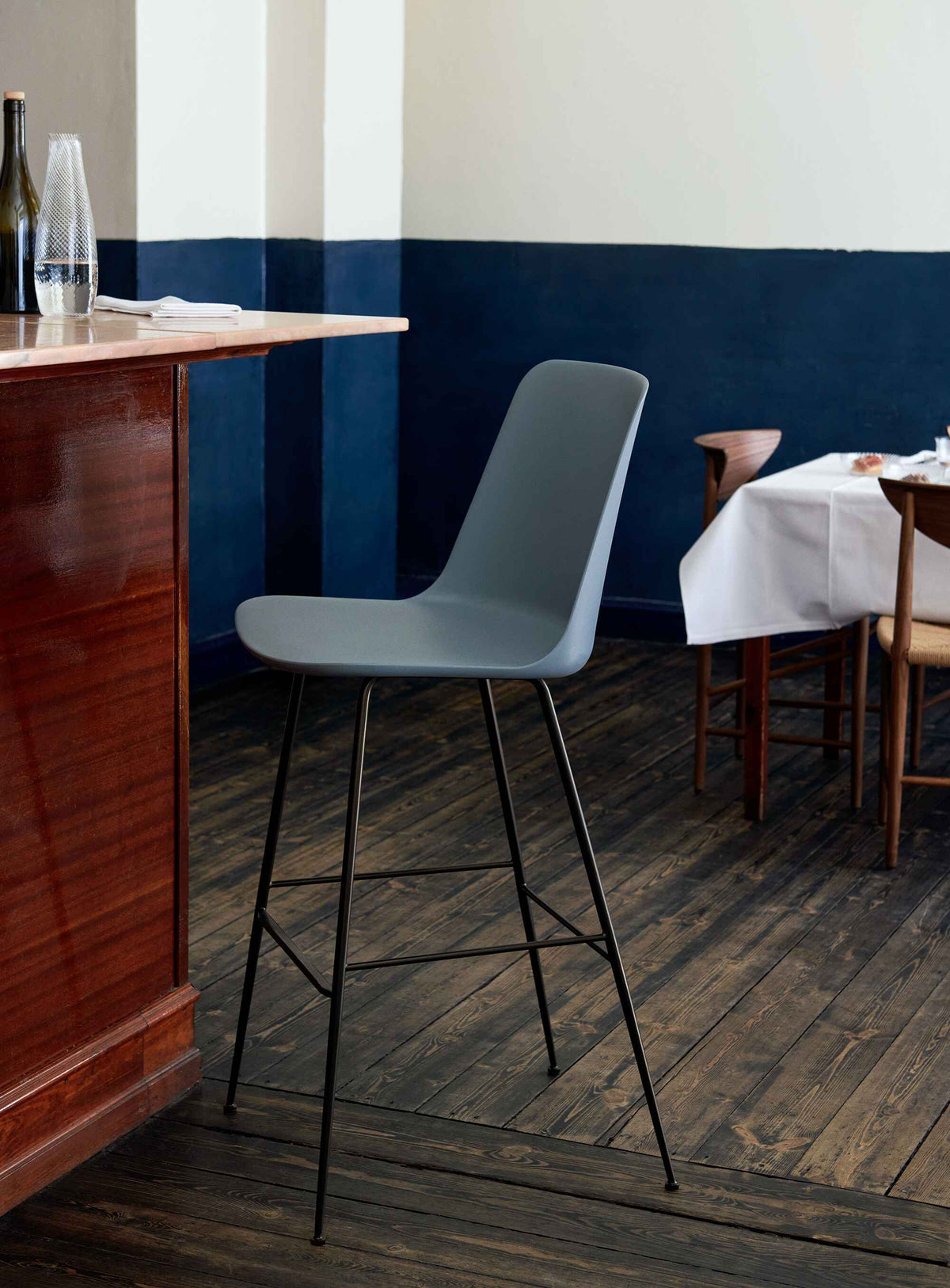 RELY bar stool in white with a brown steel base