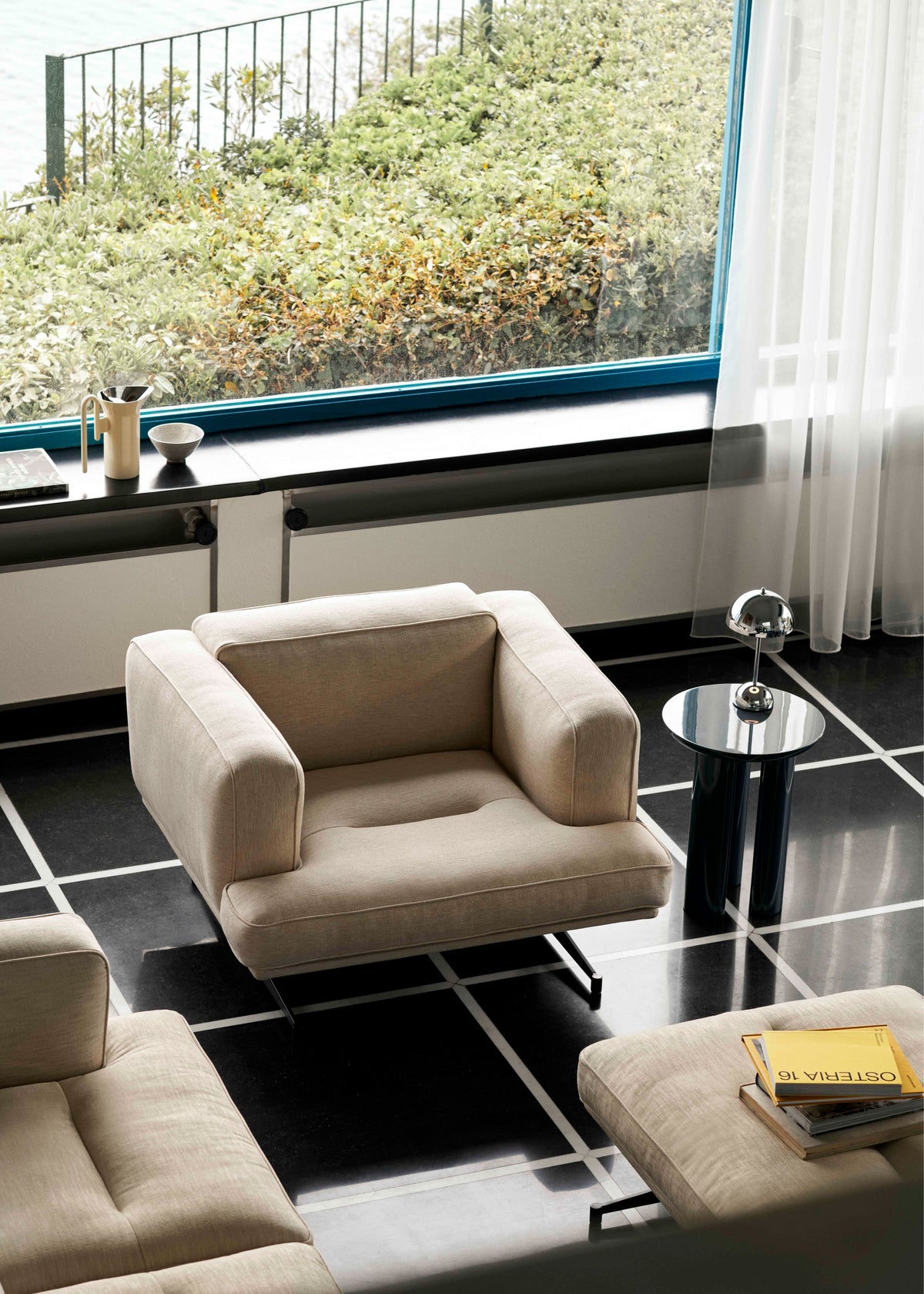INLAND AV21 upholstered armchair with a black base