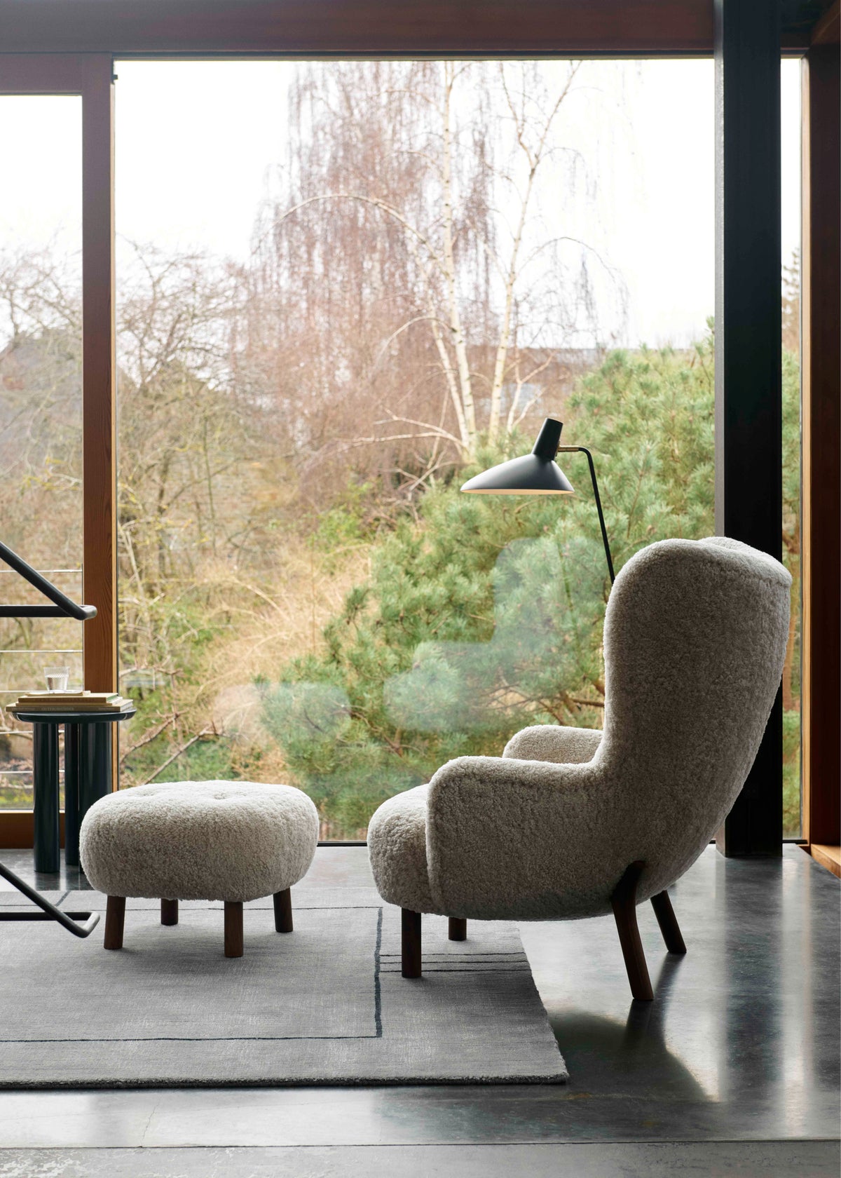 PETRA armchair with footrest upholstered with a walnut base
