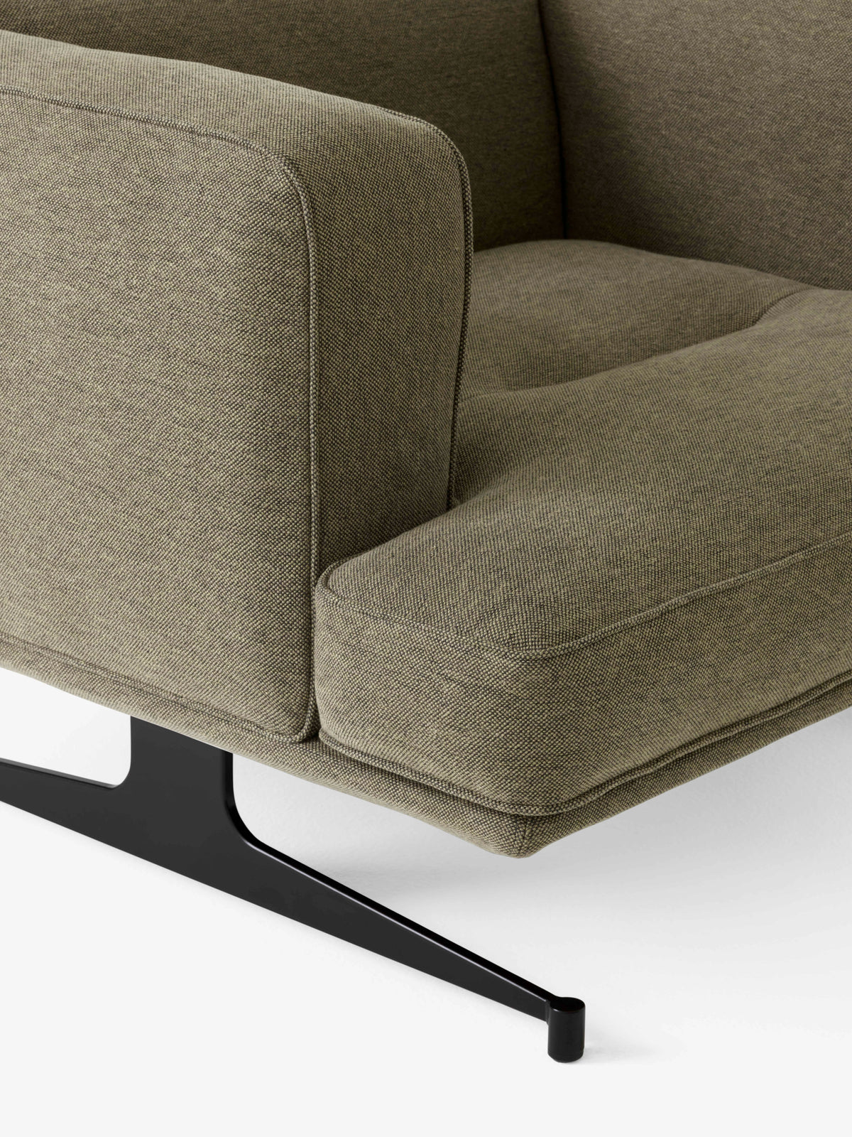 INLAND AV21 upholstered armchair with a black base