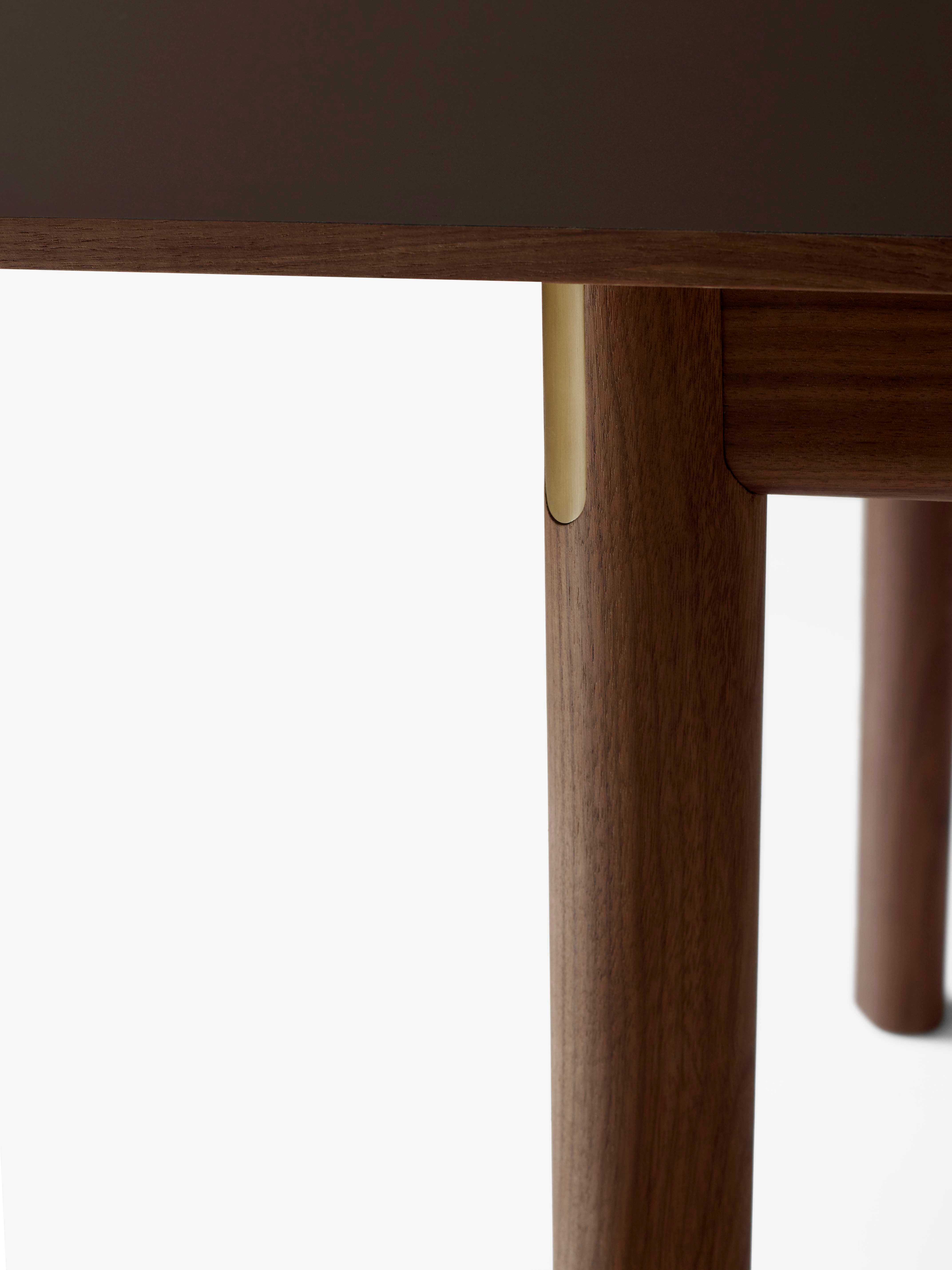 PATCH extendable table with a brown laminated top and walnut base
