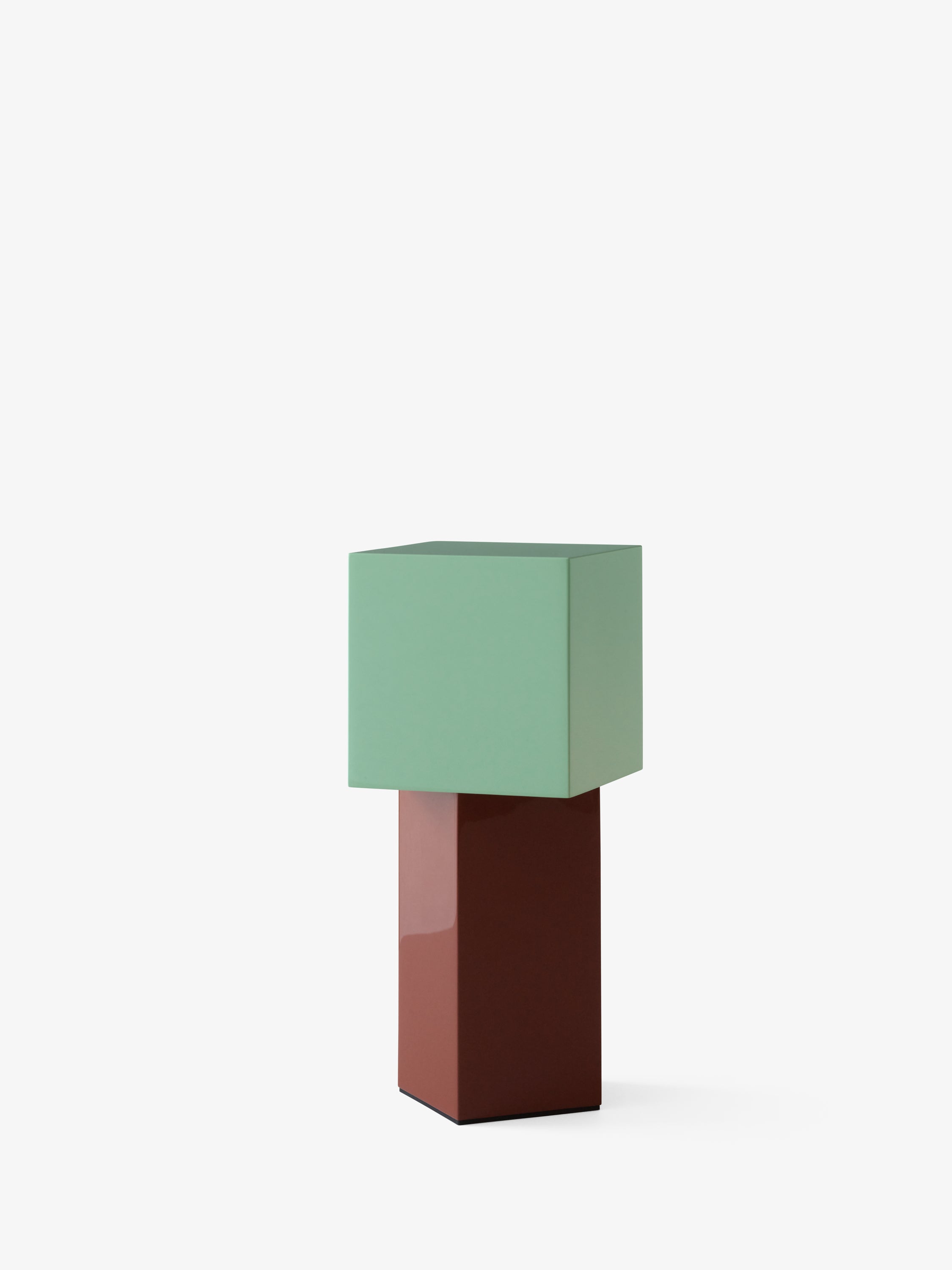 Portable lamp PIVOT ATD7 with a mint shade and a brick base.