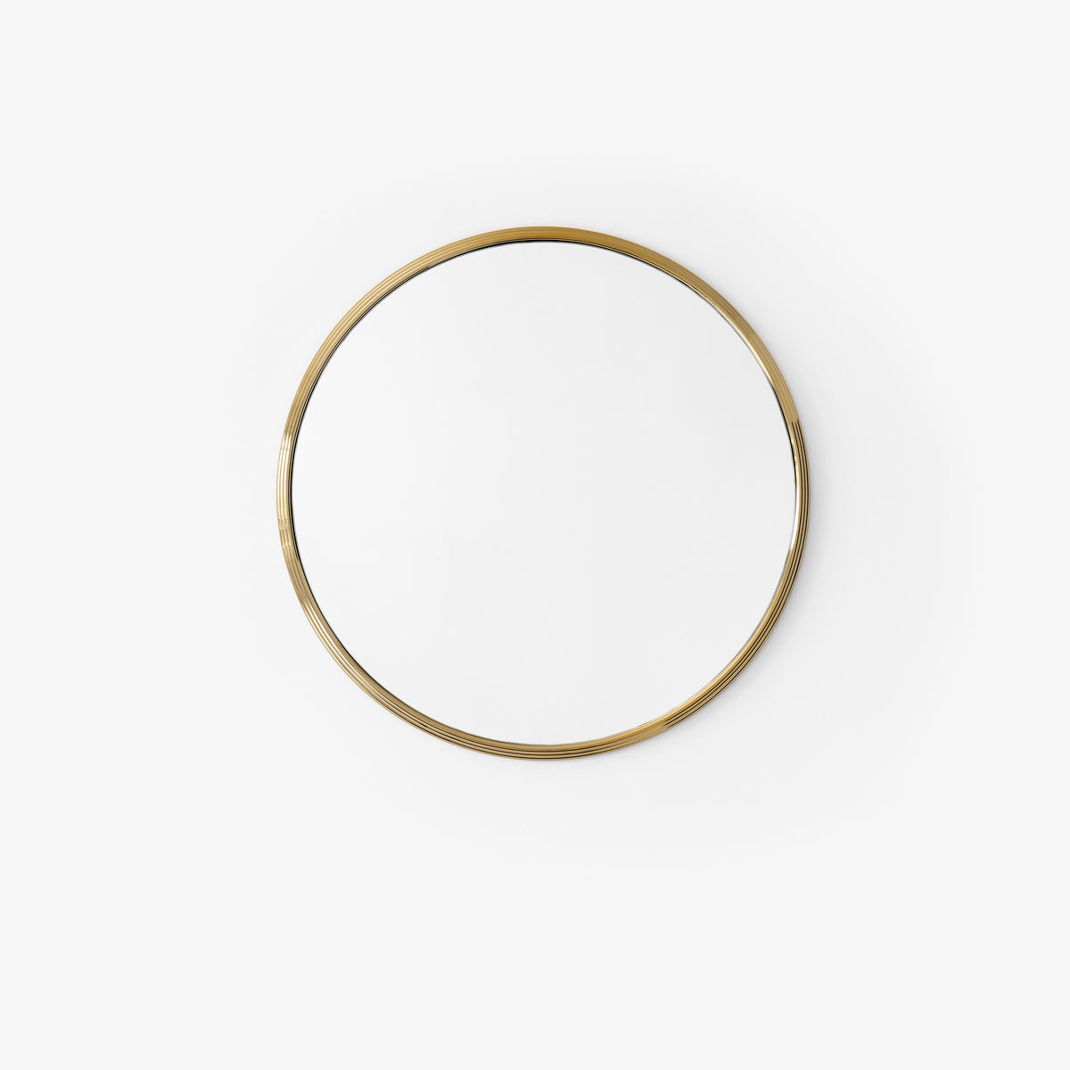 Round wall mirror SILLON with a brass frame