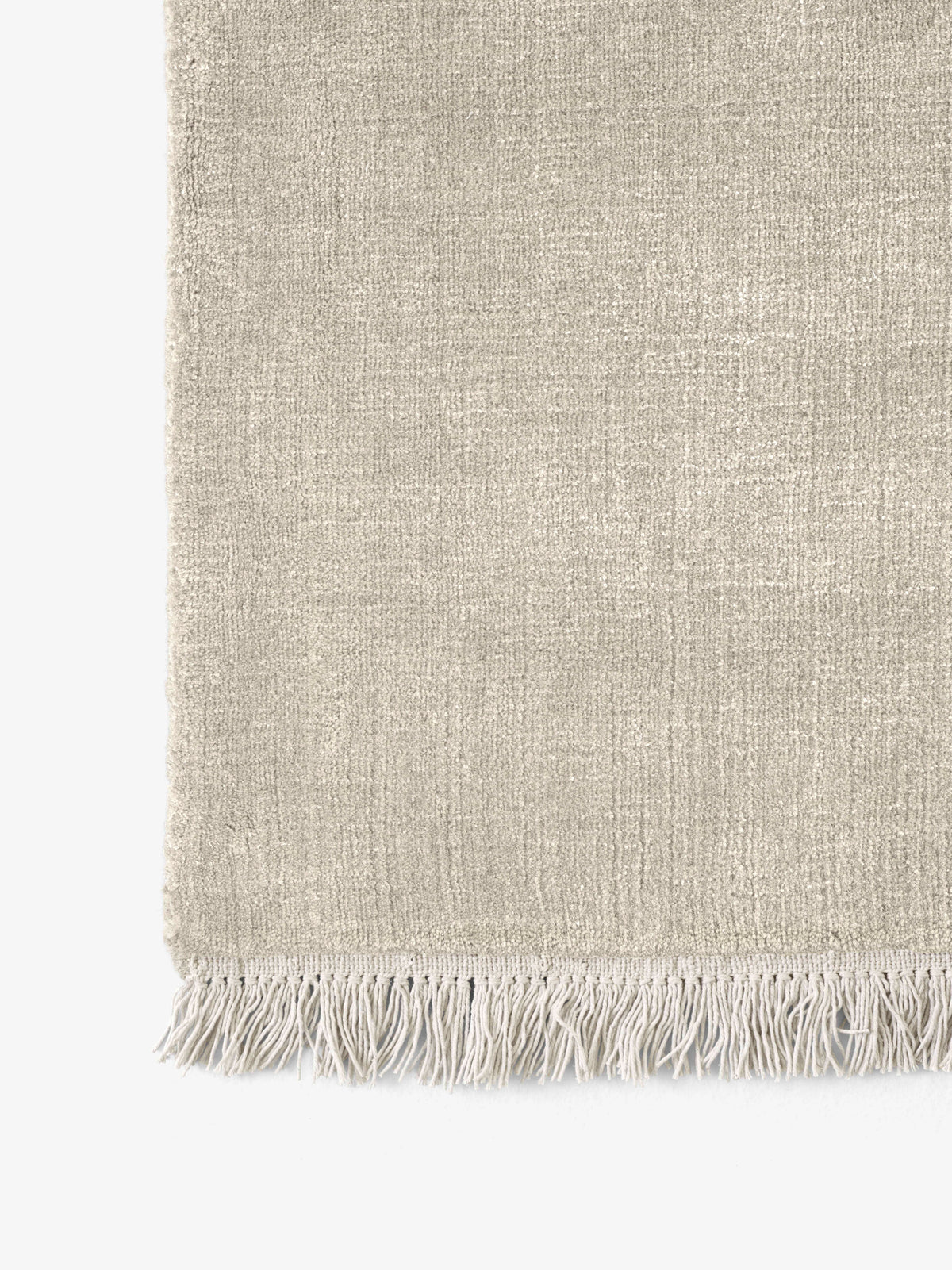 THE MOOR fringed rug in beige