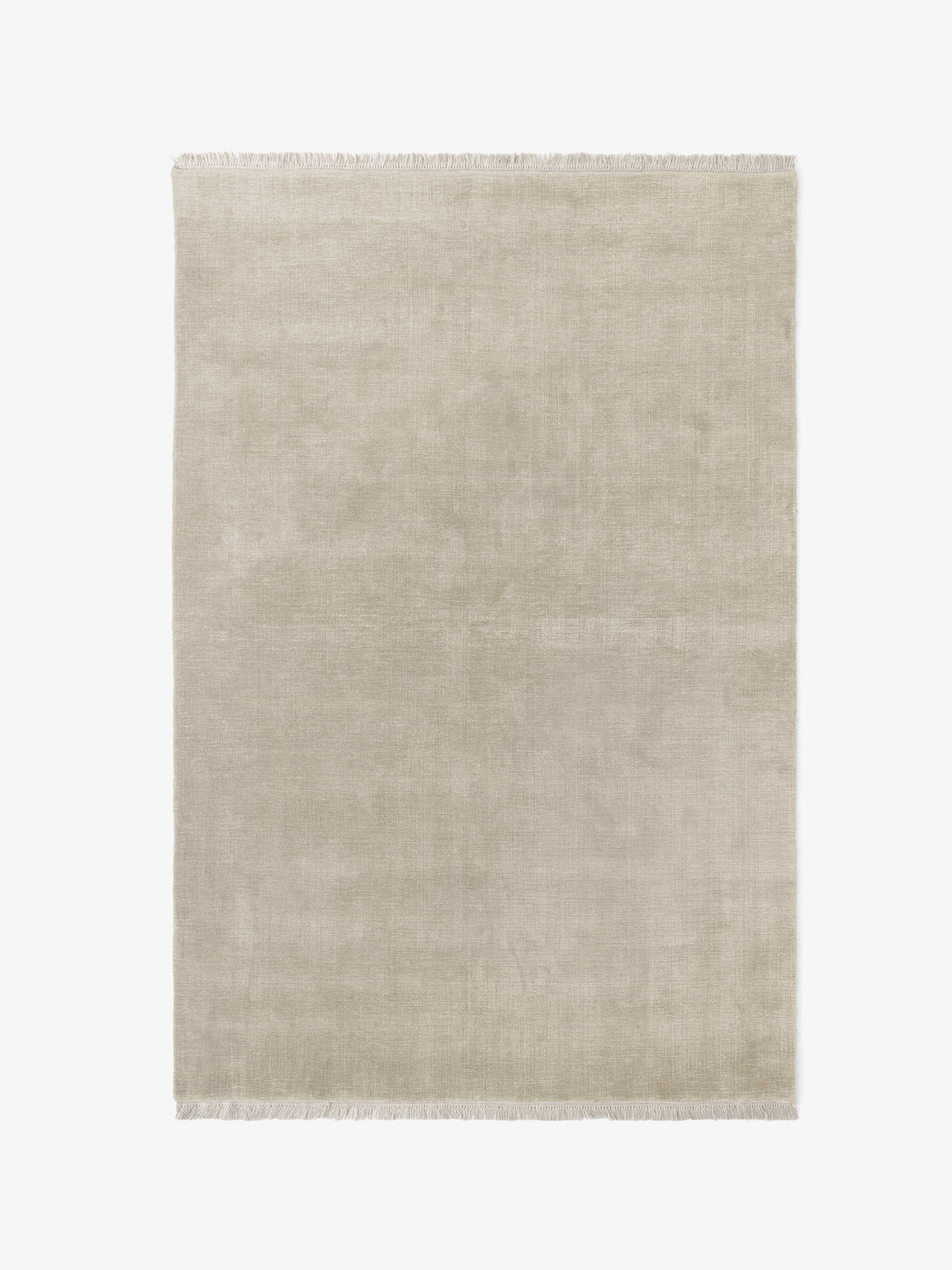 THE MOOR fringed rug in beige