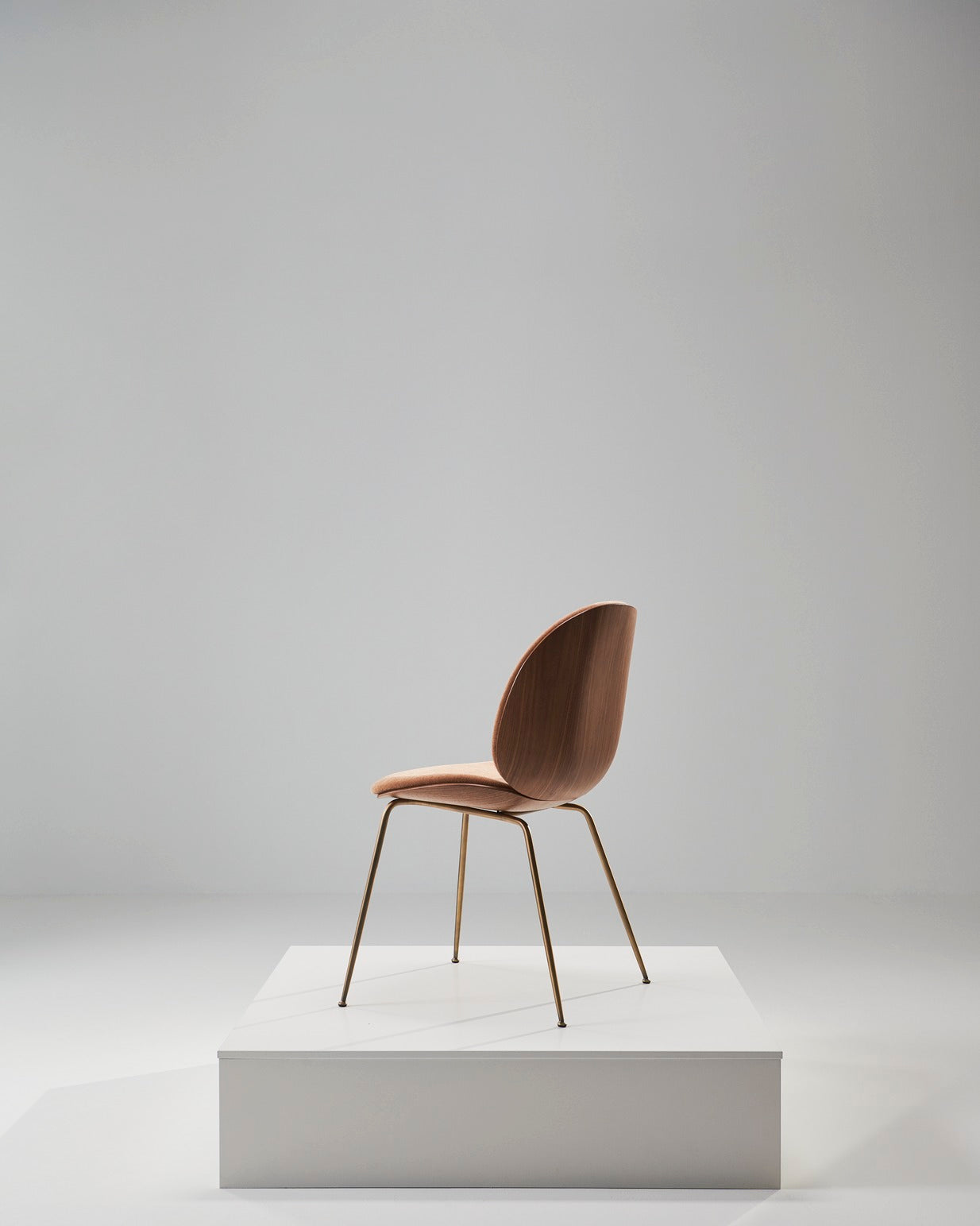 BEETLE upholstered chair with walnut wood and brass base