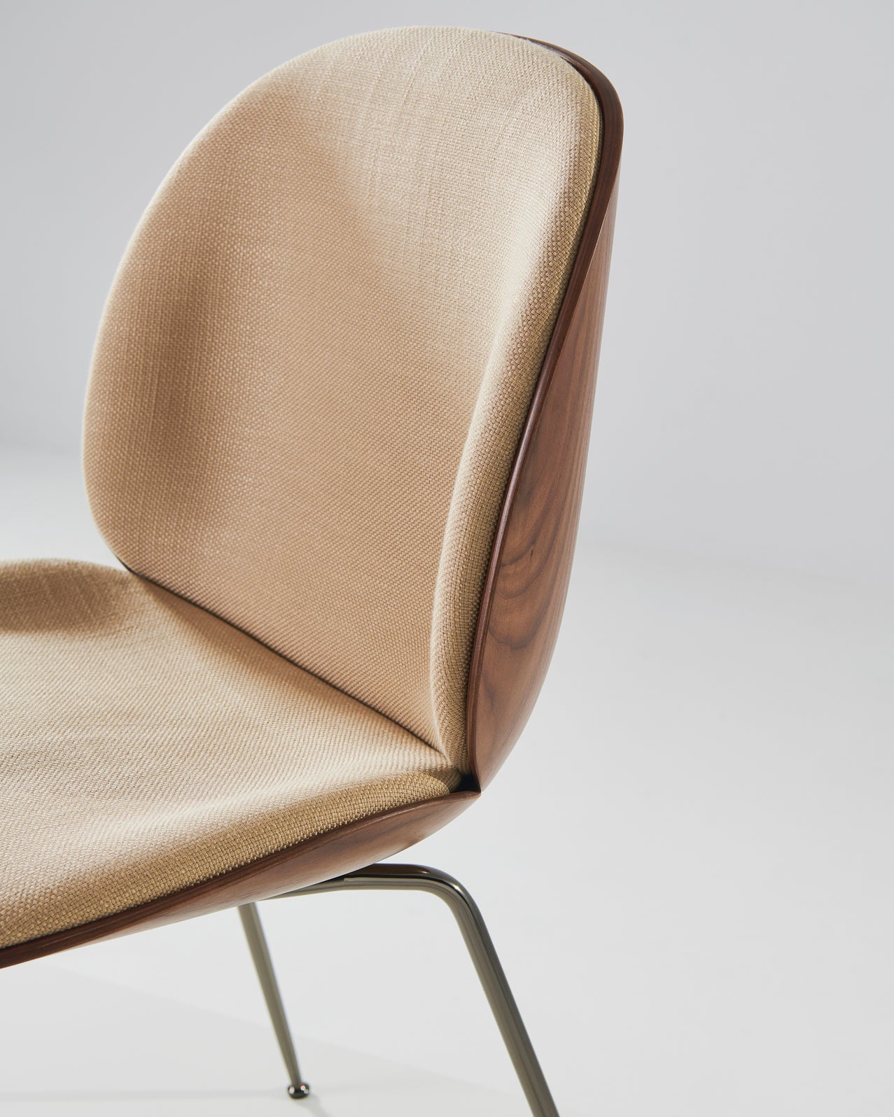 BEETLE upholstered chair with walnut wood and brass base