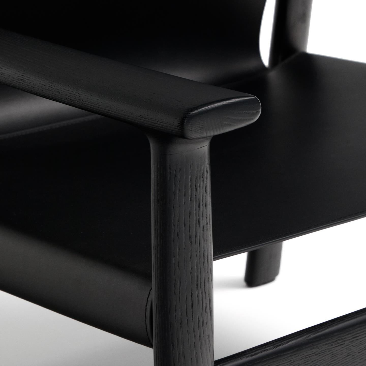 JAN armchair in black recycled leather with black ash wood
