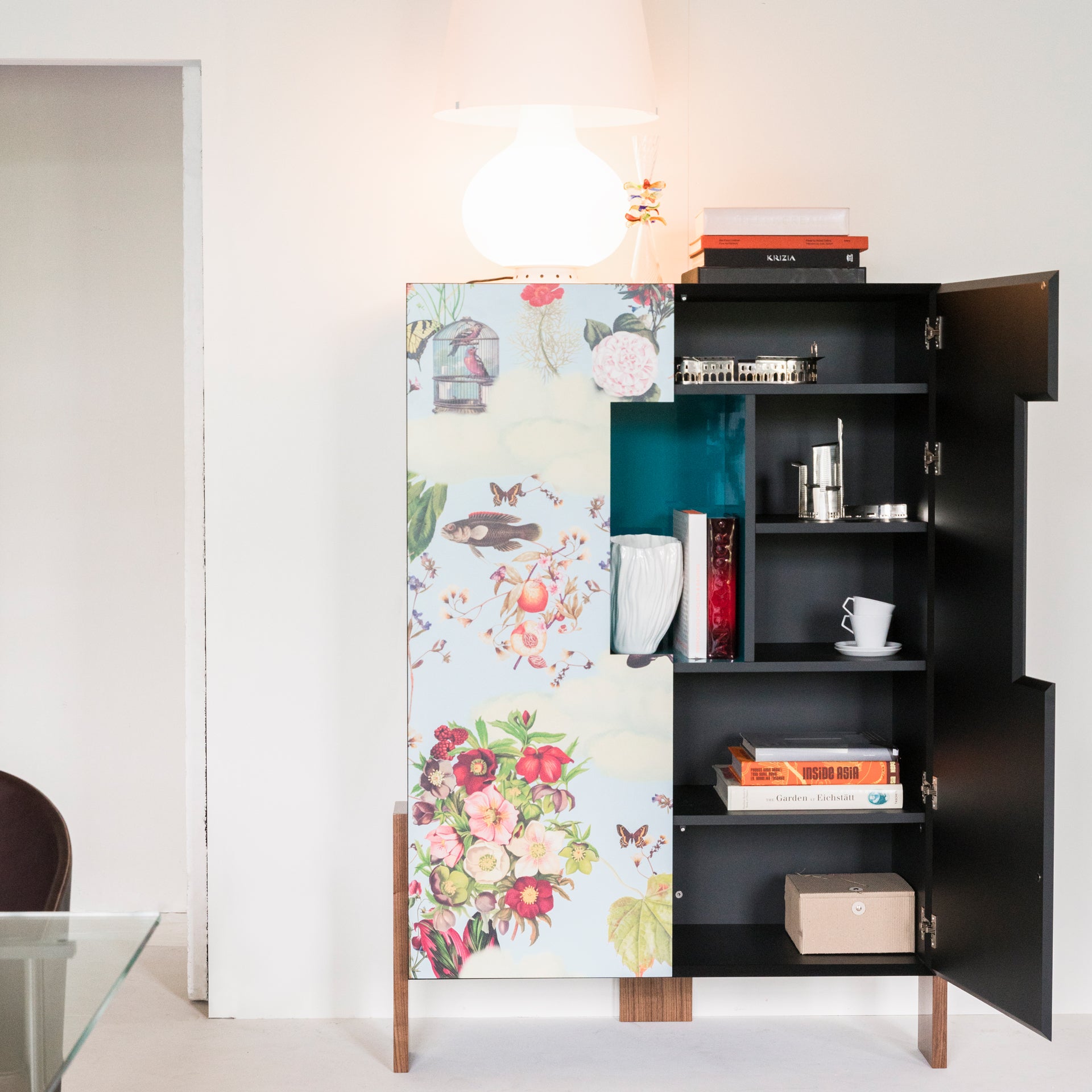 Blue ZiQQurat bookcase with a turquoise base