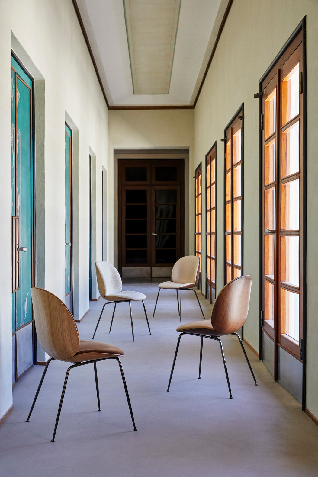 BEETLE upholstered chair with walnut wood and brass base