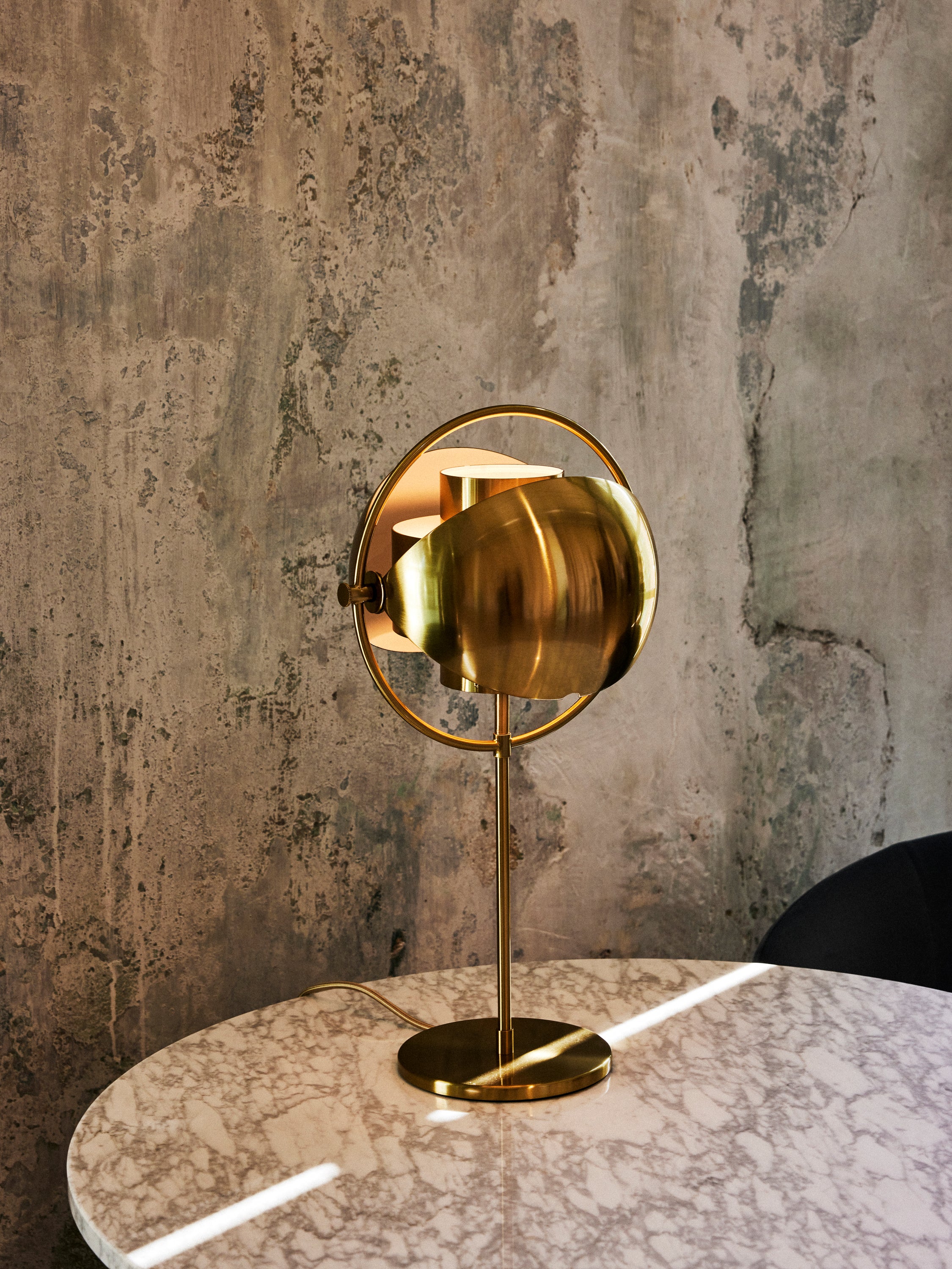 MULTI-LITE table lamp in black with a chrome base