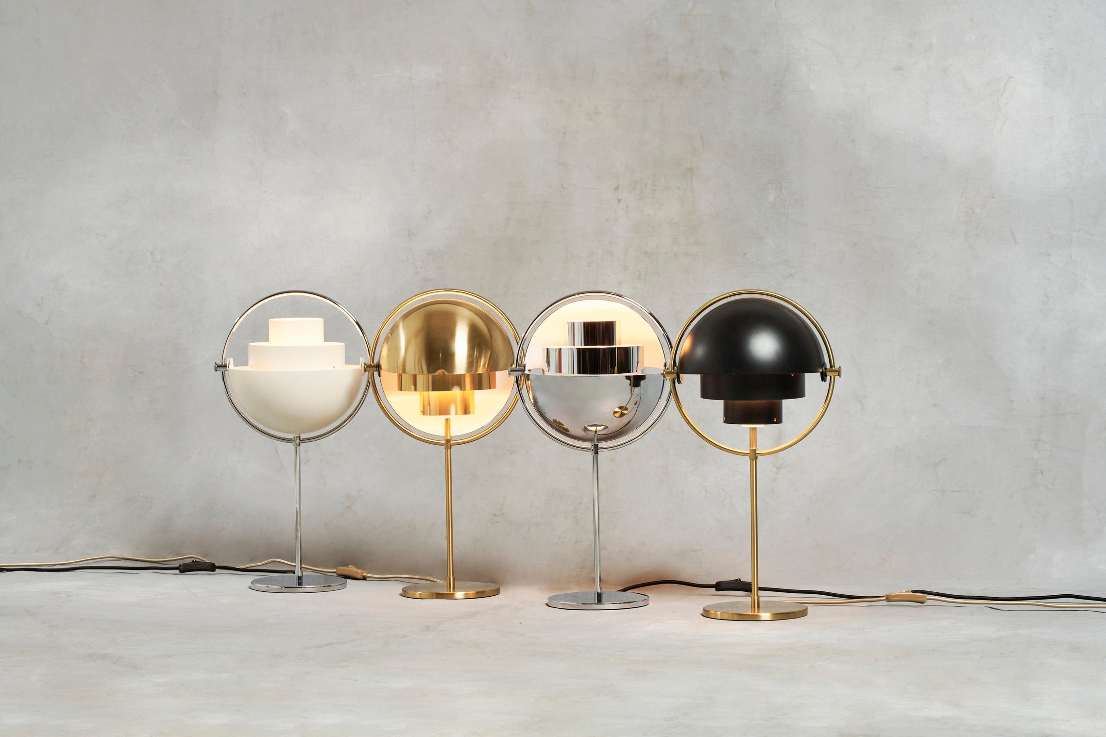 MULTI-LITE table lamp in black with a chrome base