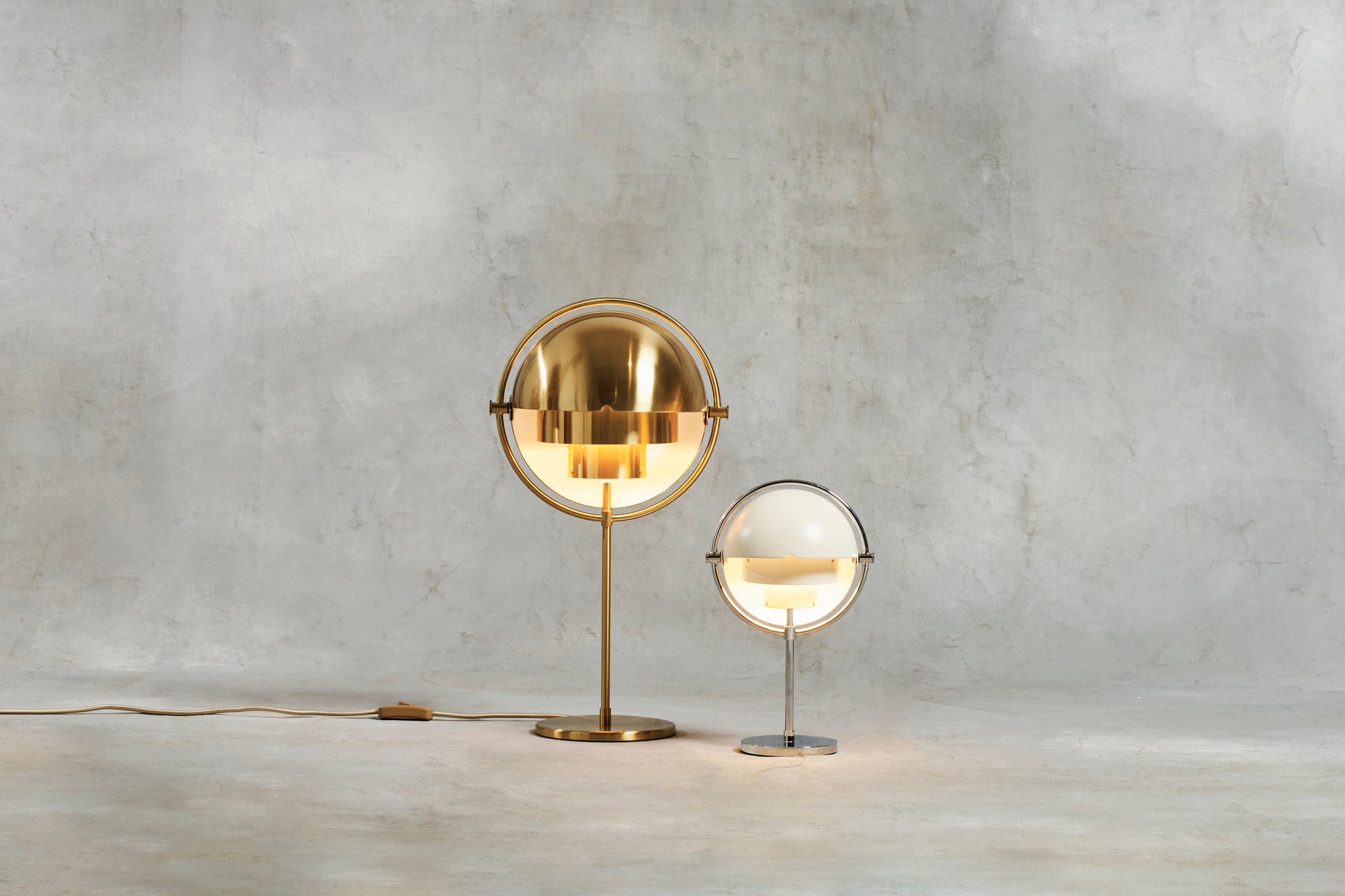 MULTI-LITE table lamp in black with a chrome base