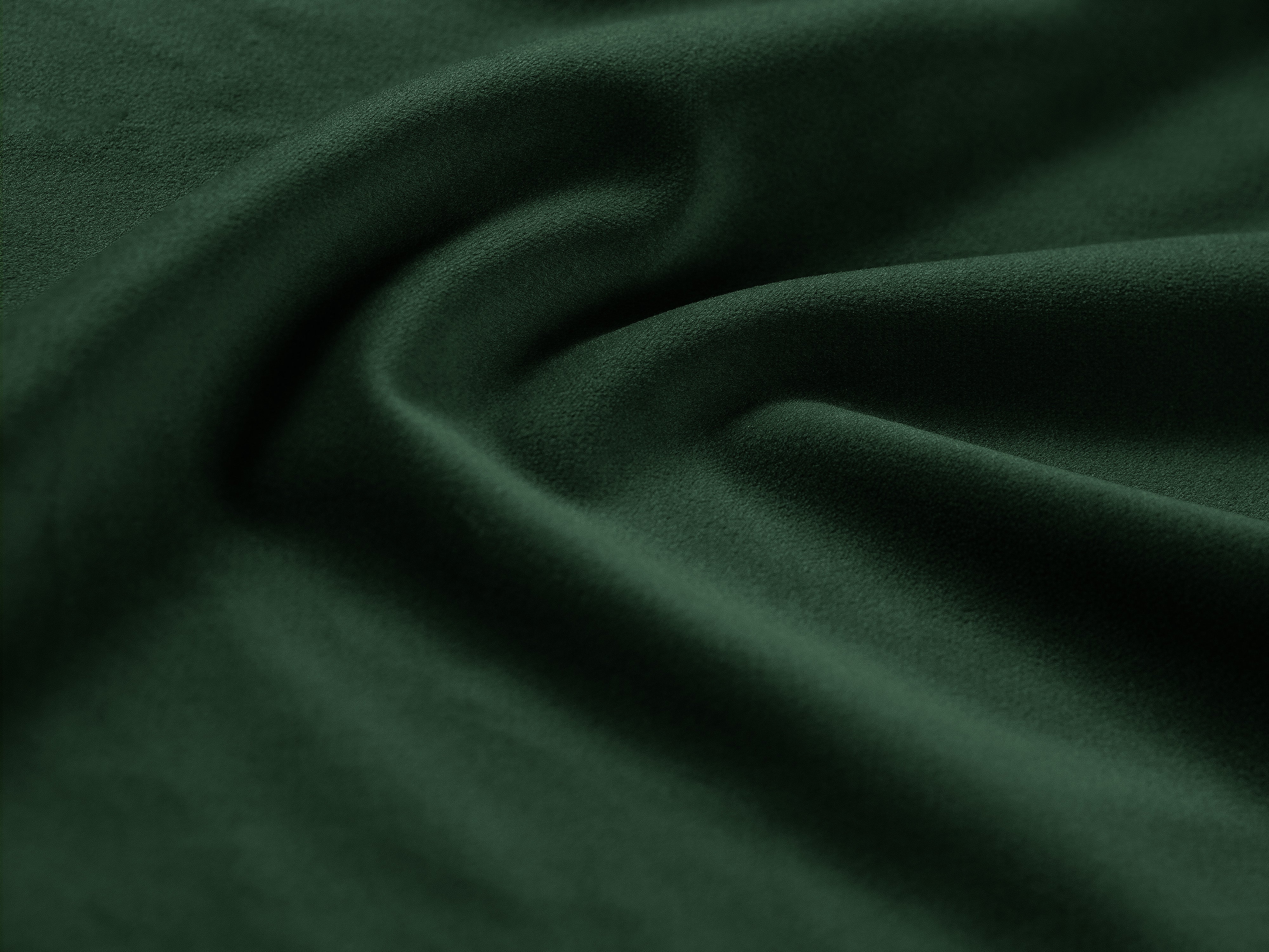 Left-facing velvet corner sofa JODIE in bottle green, seating three.