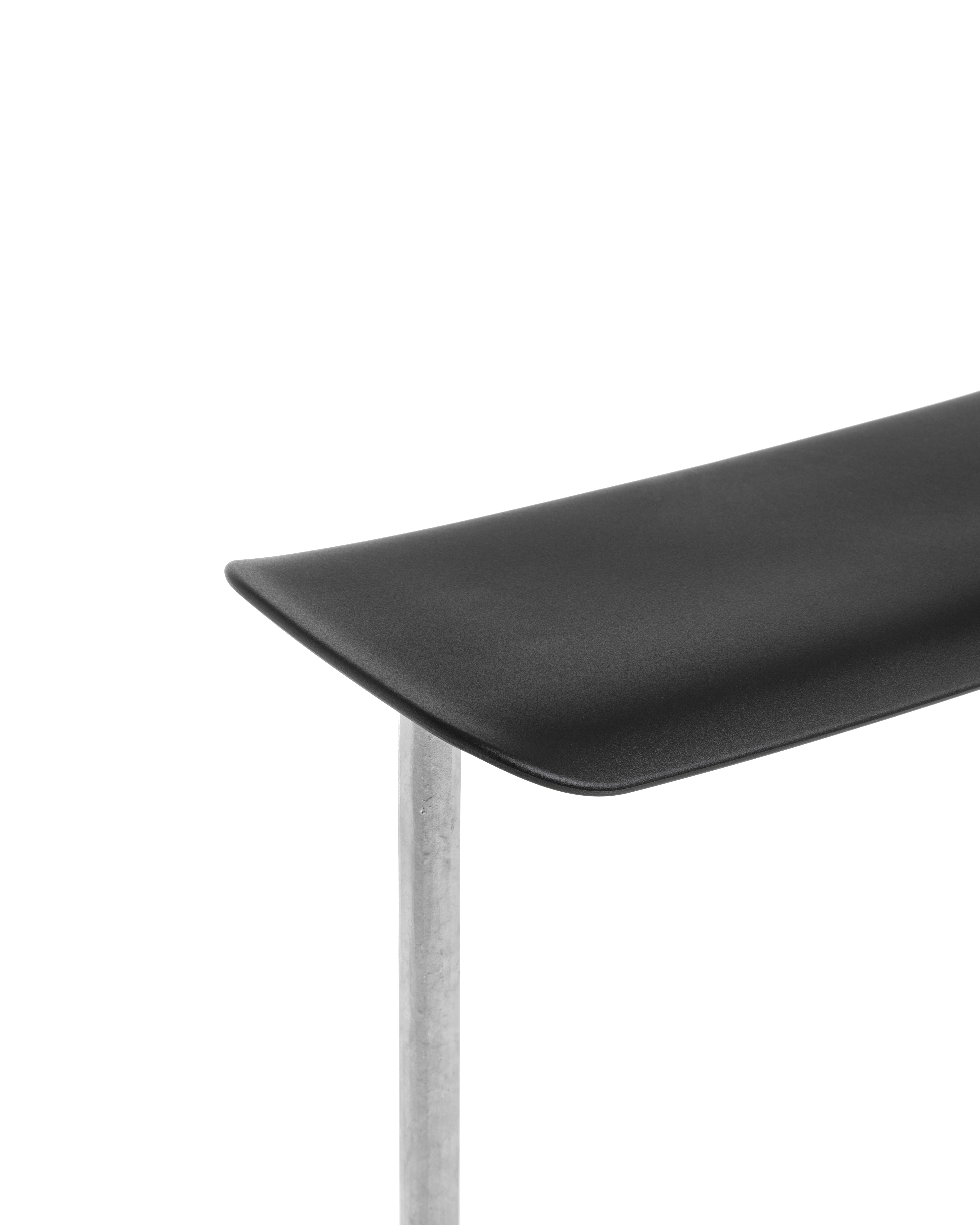 OFFICINA bar stool with a metal base and black leather seat