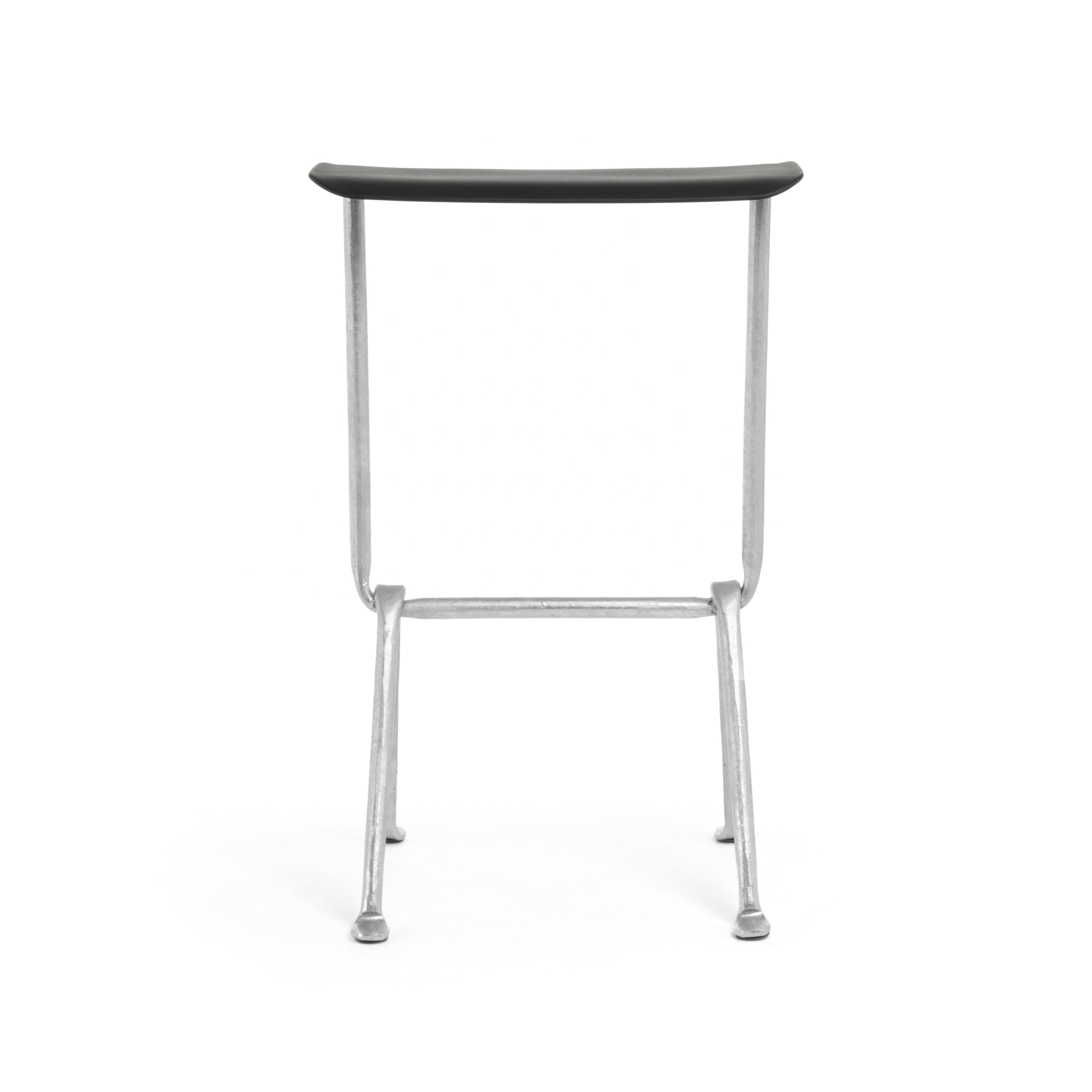 OFFICINA bar stool with a metal base and black leather seat