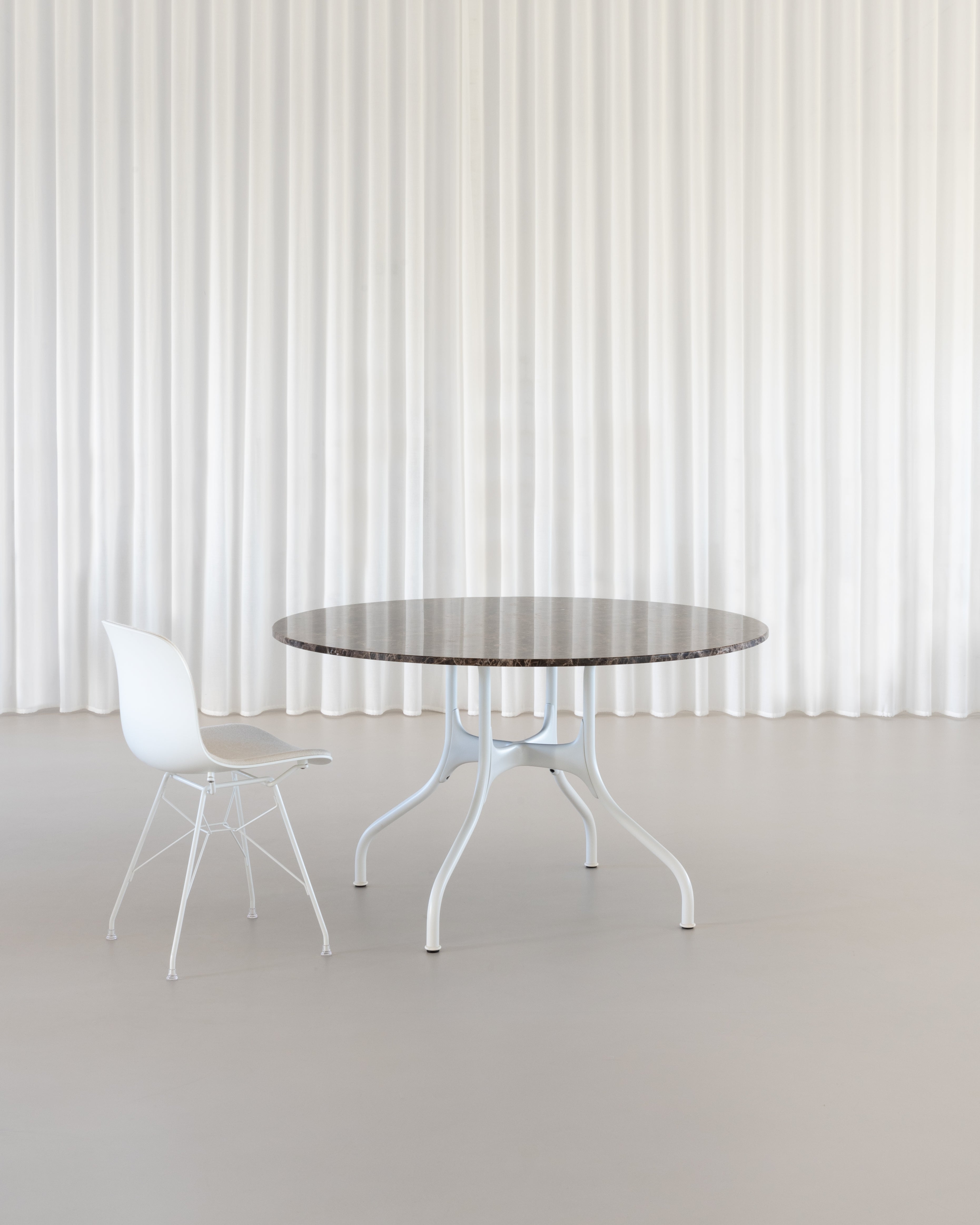 Round table MILA with a white steel base