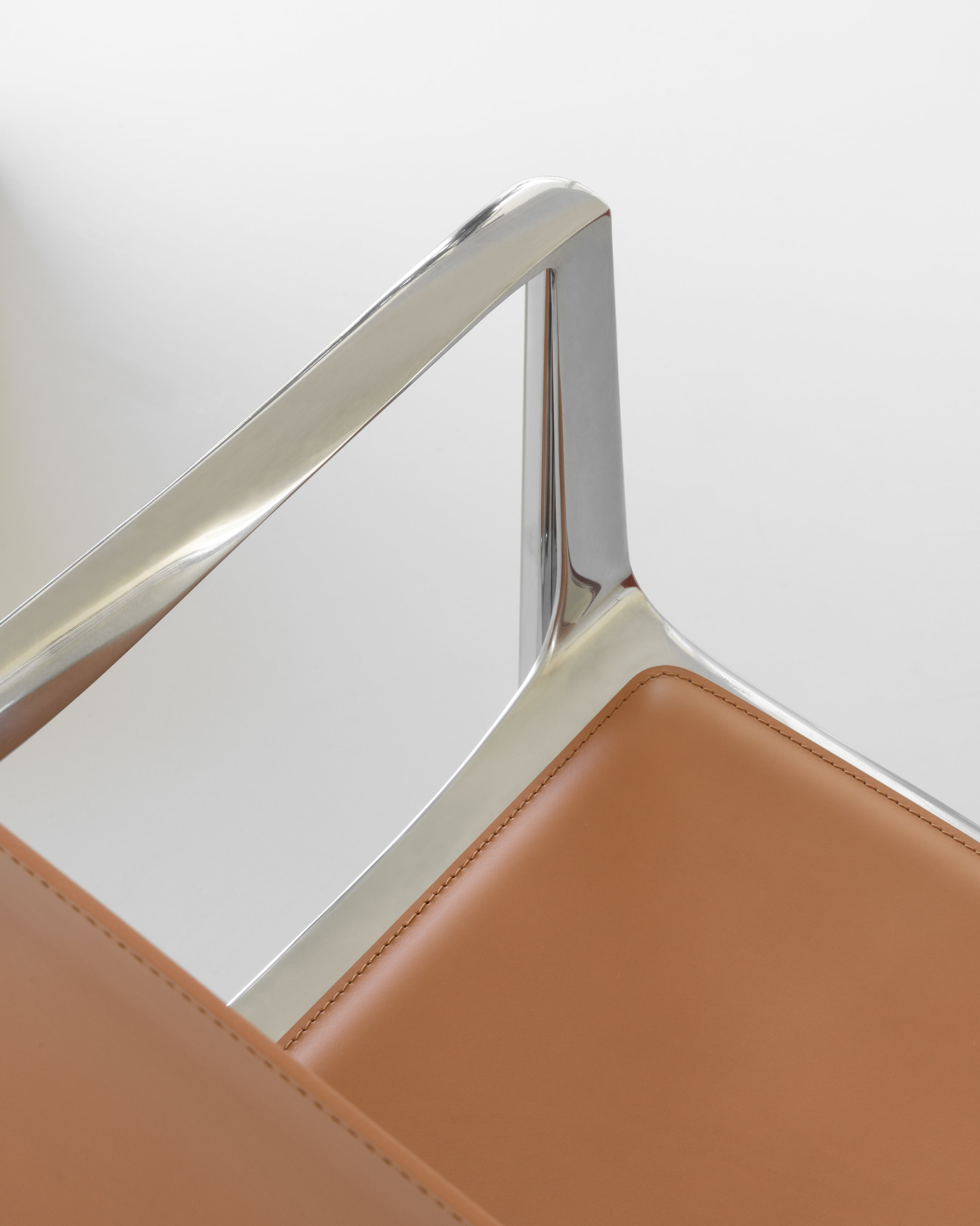 VENICE chair in cognac leather with a polished base