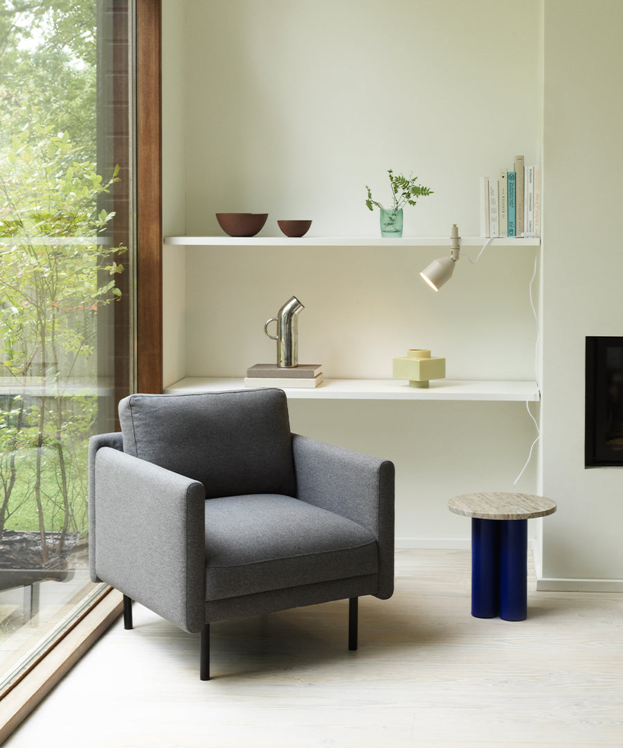 White rar armchair with a black base
