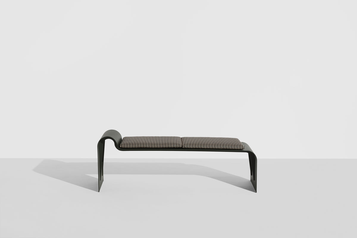 ECLIPSE bench in dark green with a striped cushion
