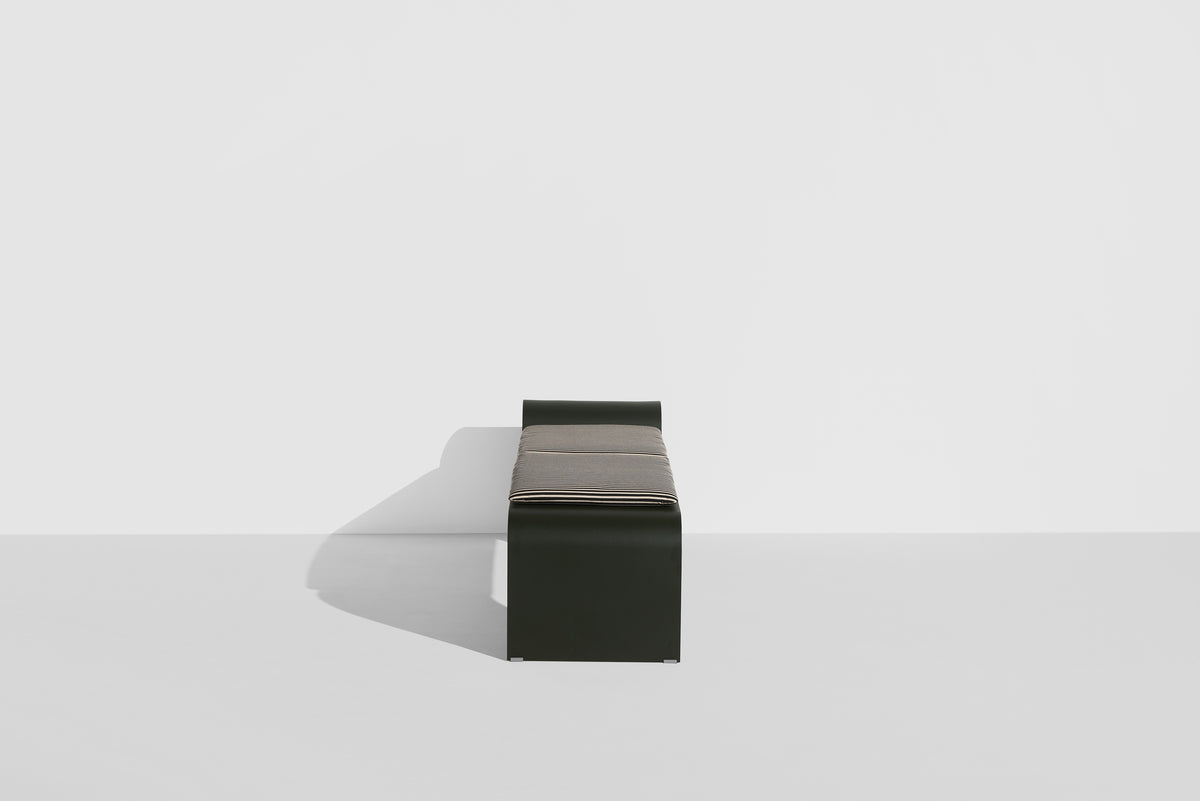 ECLIPSE bench in dark green with a striped cushion