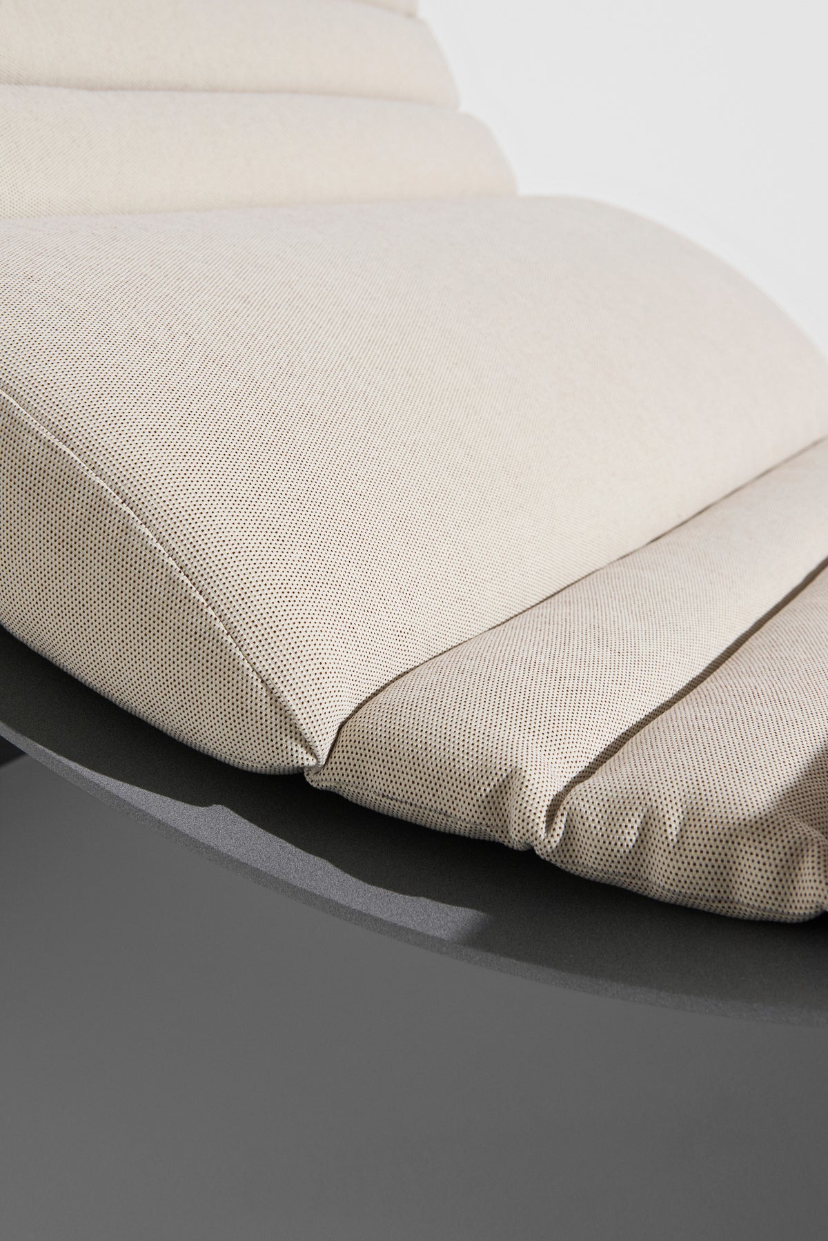 ECLIPSE gray lounge chair with a cream cushion