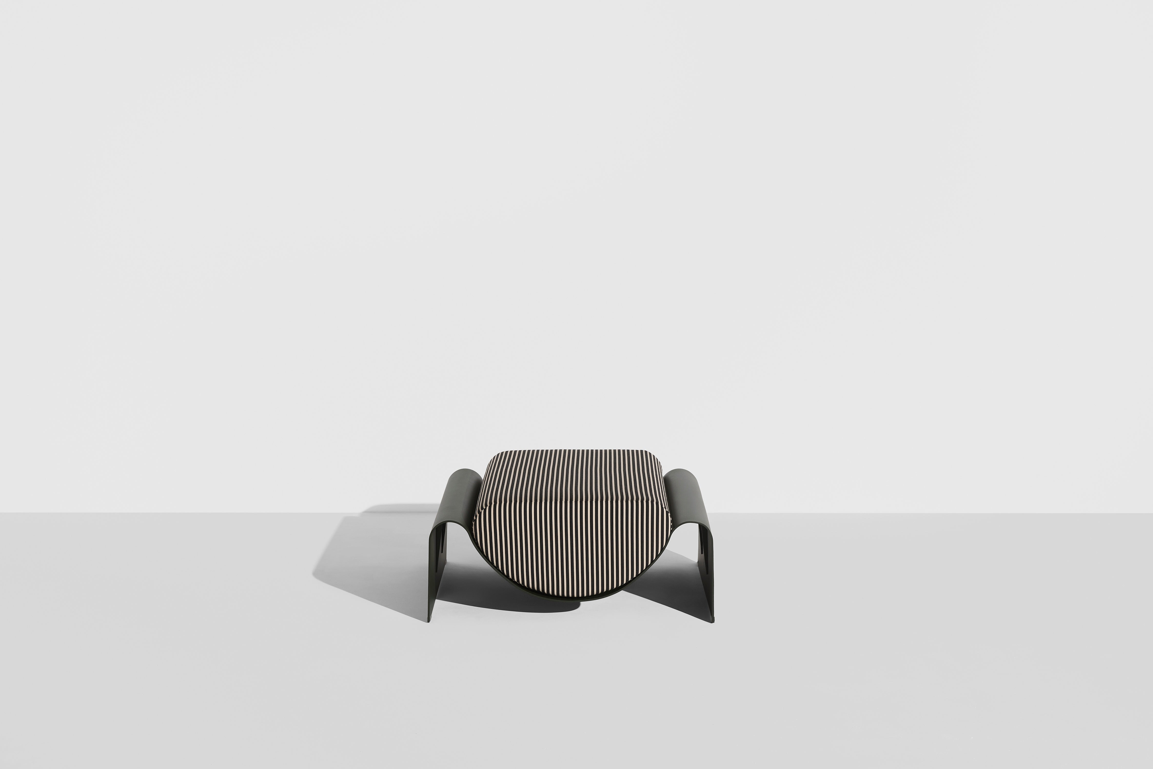 ECLIPSE pouf in dark green with a striped cushion