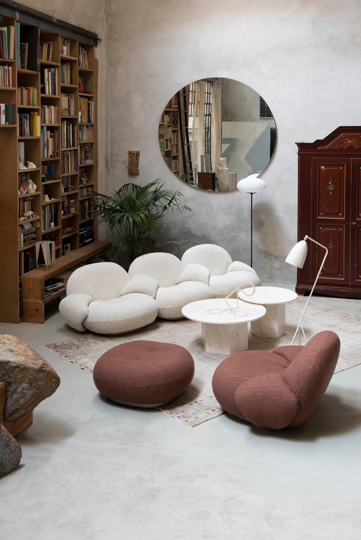 PACHA upholstered pouf with black base