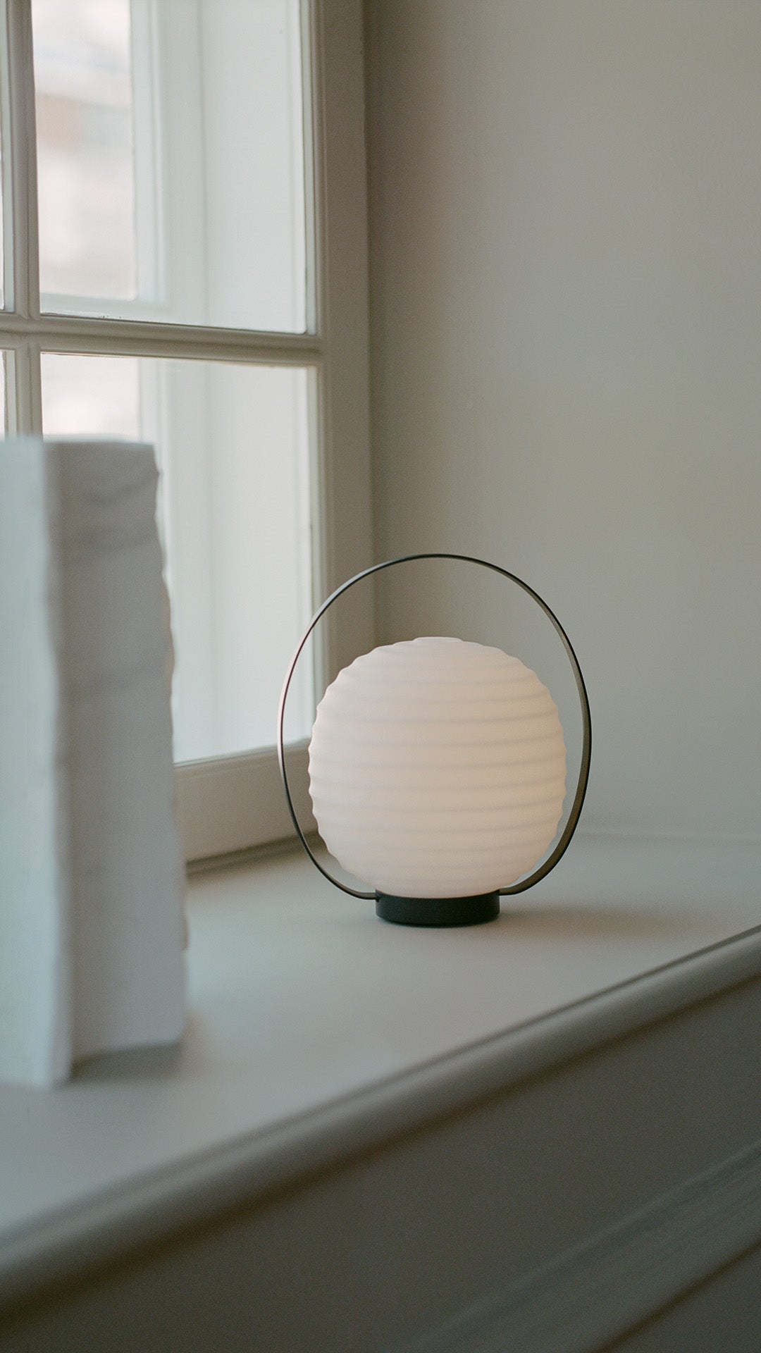 Lantern white portable lamp with a black handle