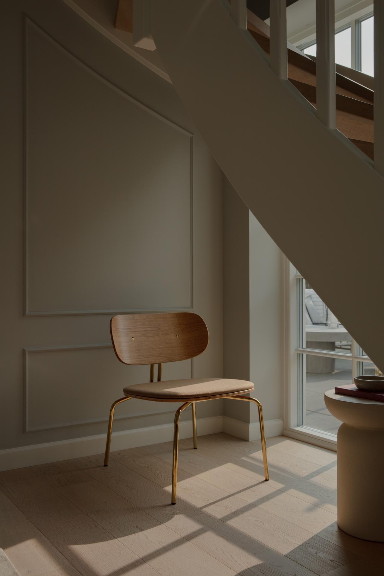 Curious armchair brown plush with a golden base