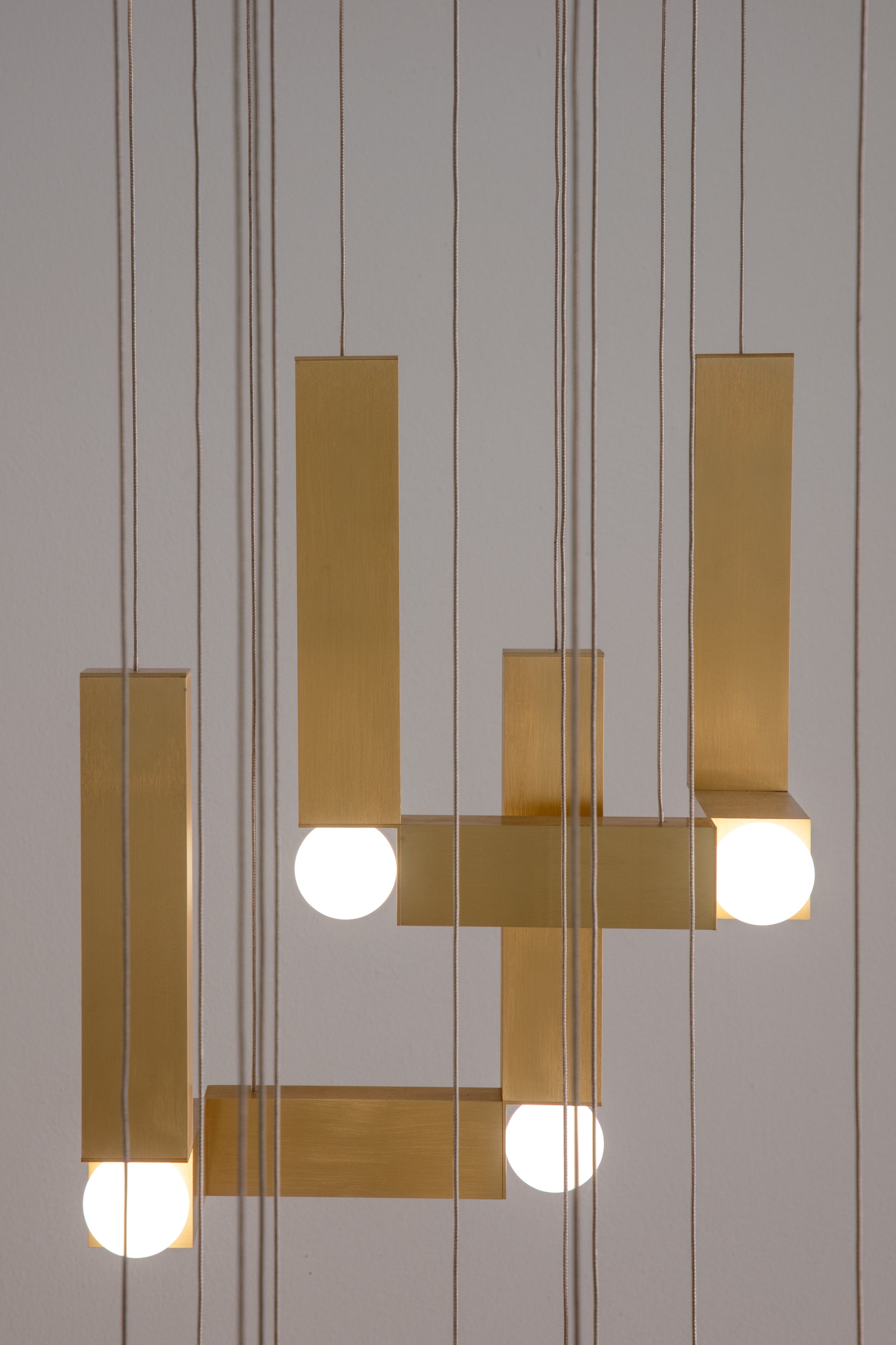VESPER DUO pendant lamp with an opal shade and gold finish.
