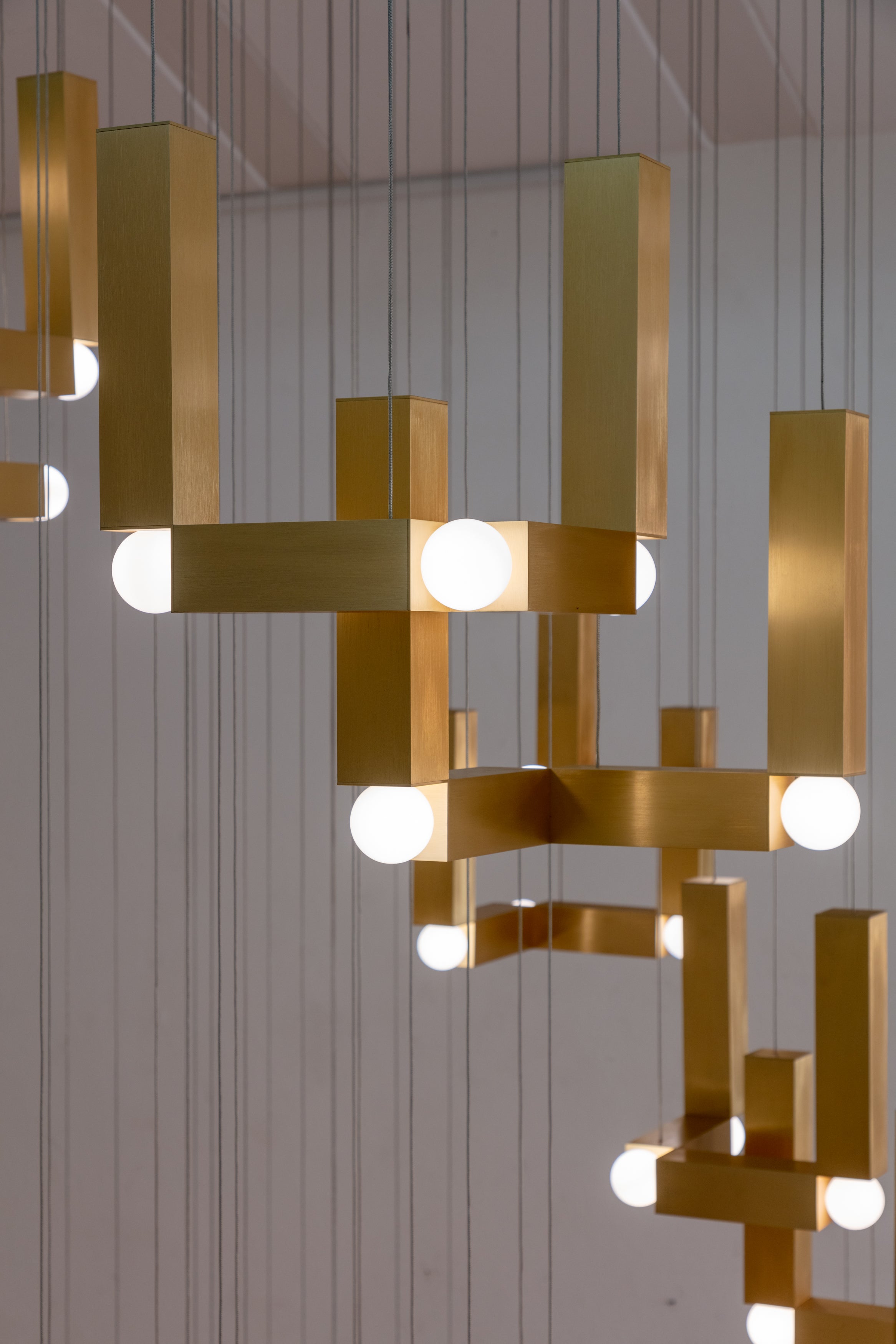 VESPER DUO pendant lamp with an opal shade and gold finish.