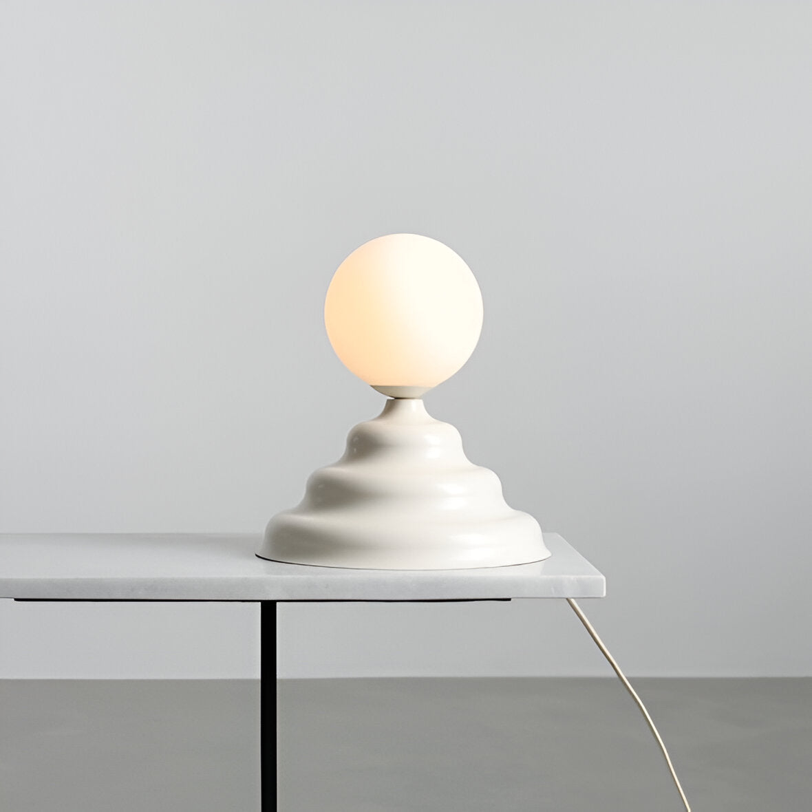 Table lamp with a glass lampshade cream wave
